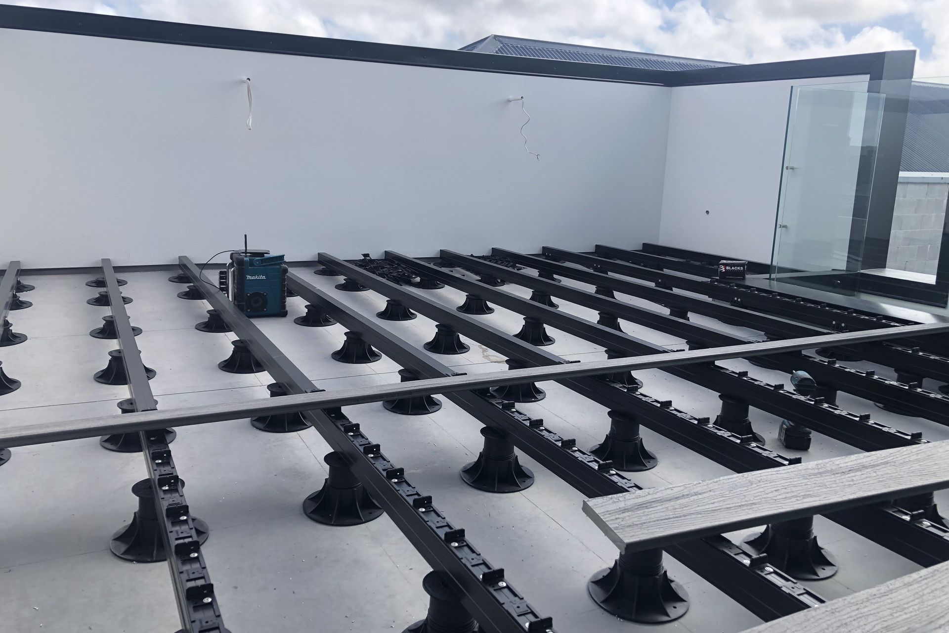 A non-penetrative decking system, Modas was specified for this rooftop balcony.