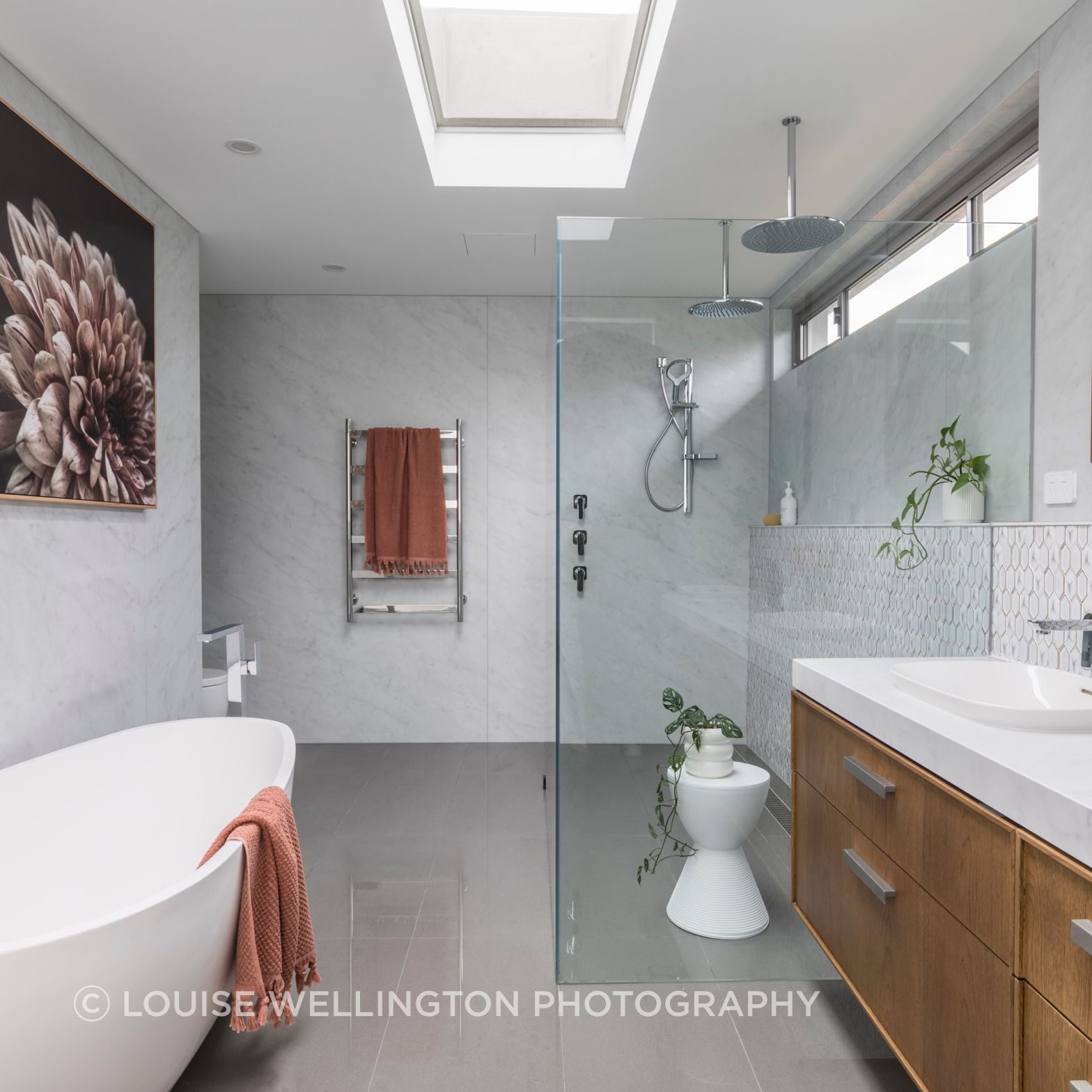 Oxford Project. 
Luxurious master ensuite with Neolith clad walls, a double vanity, walk-in shower and free standing bath.