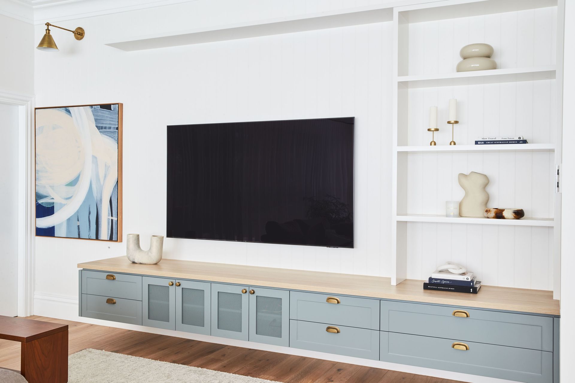 Original art and a selective choice of decor can personalise a contemporary space as demonstrated with aplomb at Lindfield House