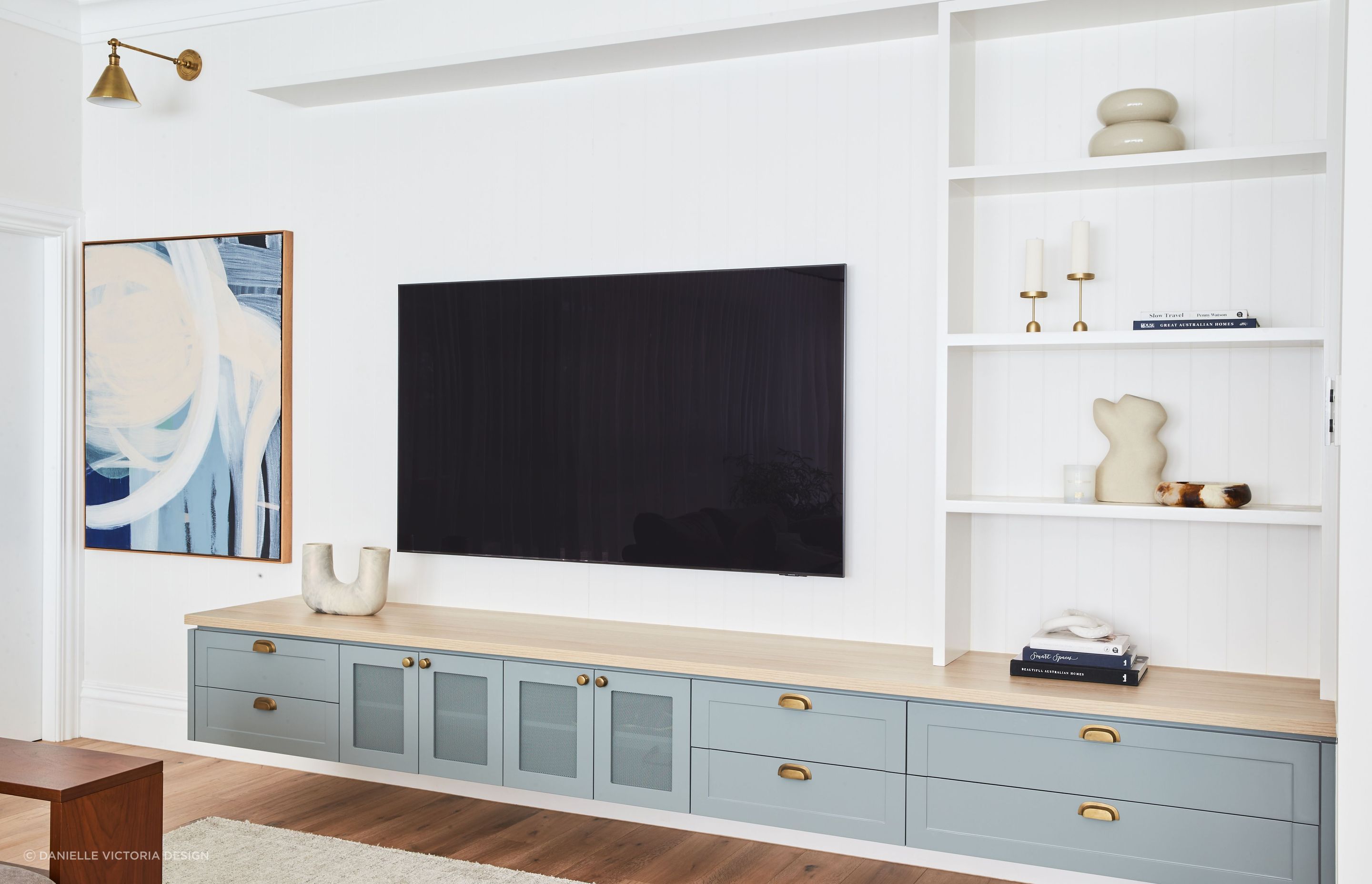 Original art and a selective choice of decor can personalise a contemporary space as demonstrated with aplomb at Lindfield House