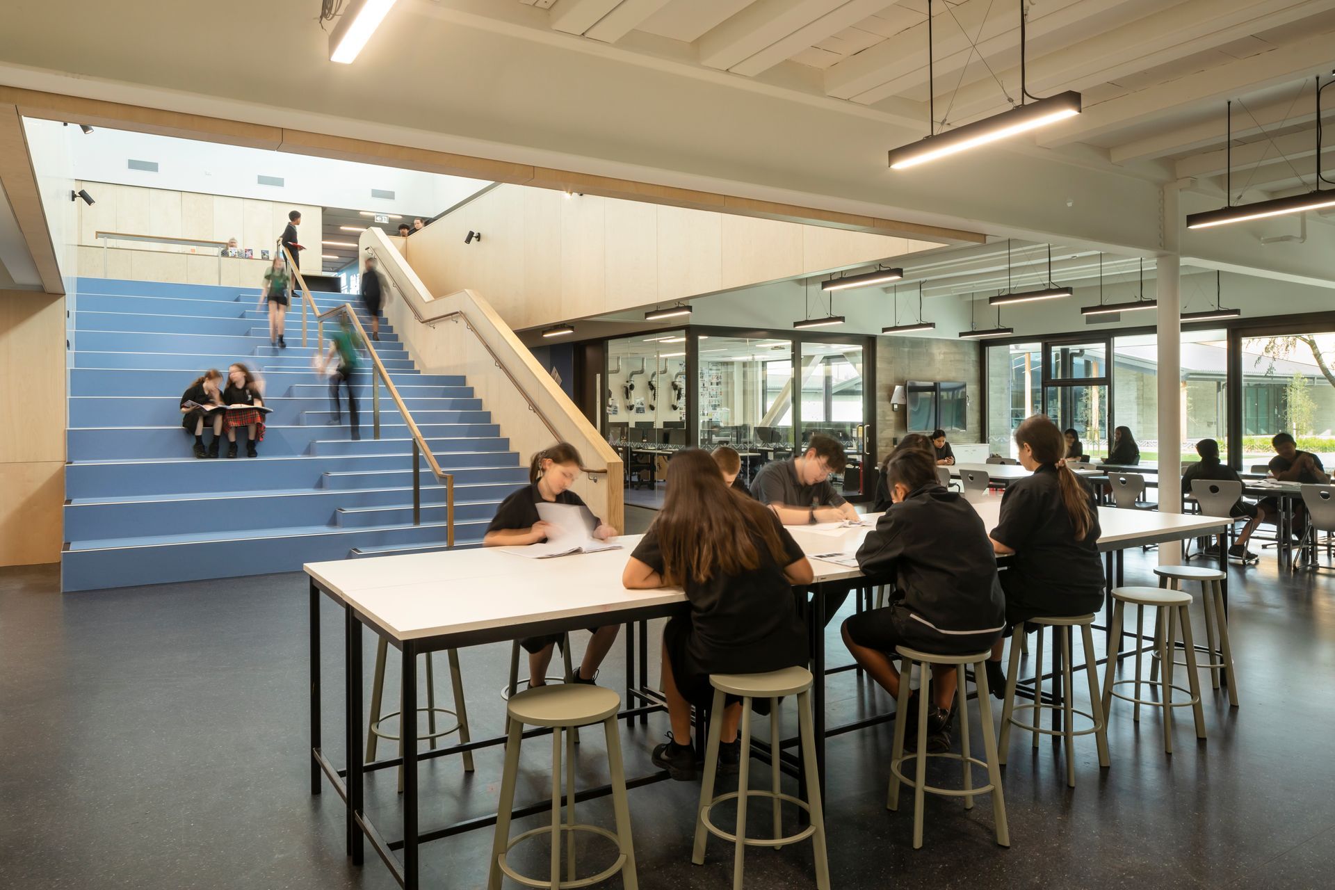 The creativity and innovation hub features blue walls and stairs, and it's the heart of the 'maker' spaces.