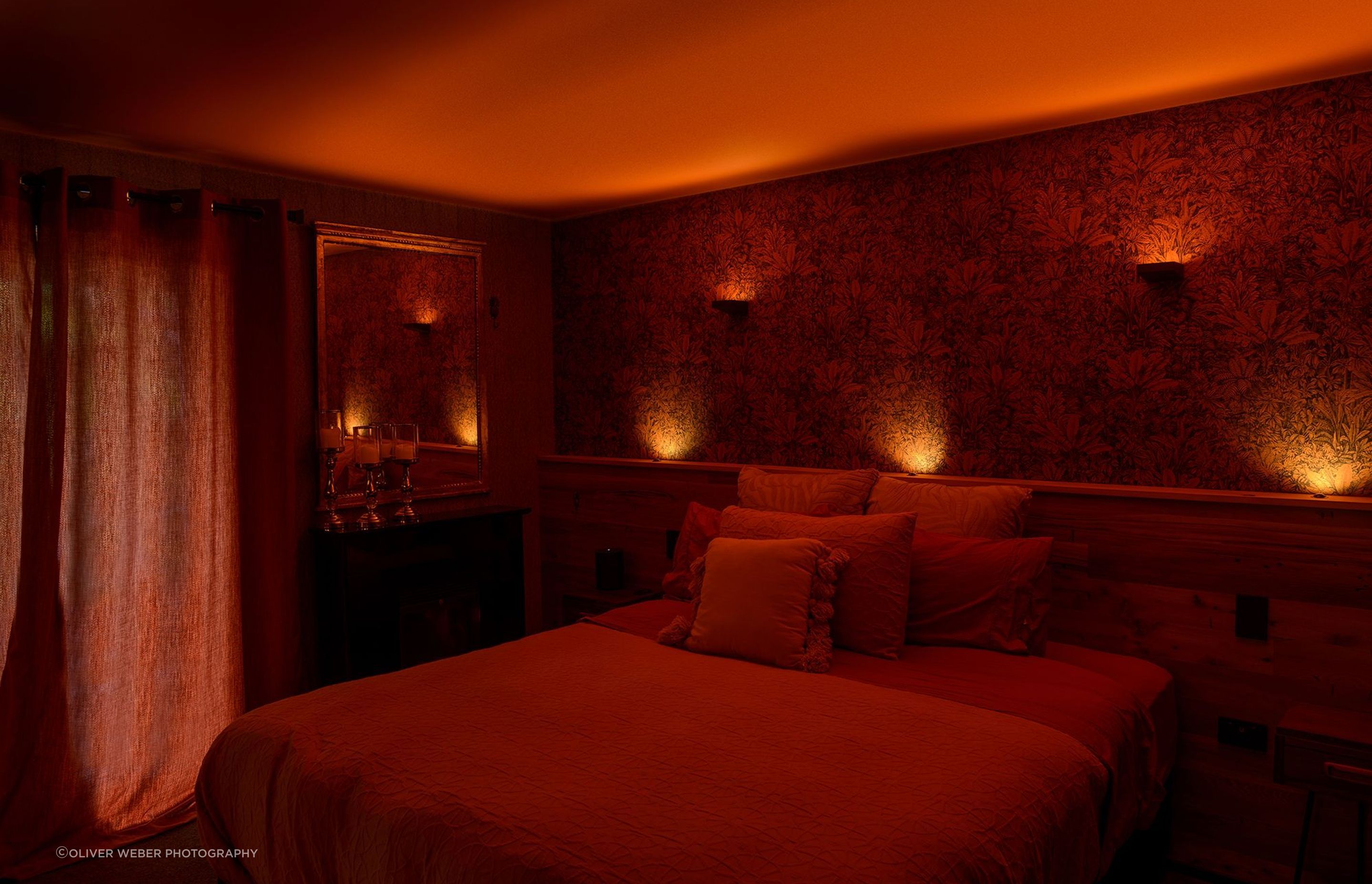 The bedroom becomes a sultry boudoir with the deep, rich ambient lighting. Product: Switch Lighting Cirro Ceiling Washer SLDL251T, Multi-LIGHTZ and Eyelid SL41-EL