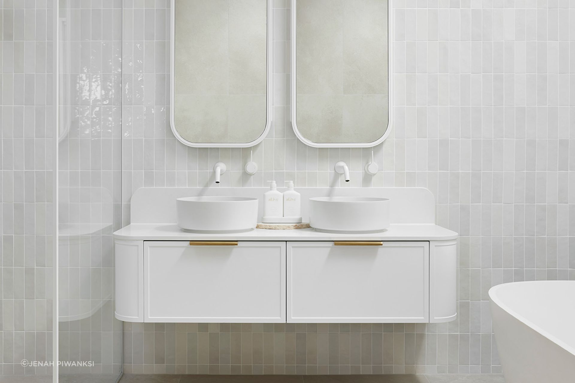 Flo Double Bowl, Ultra White, Brushed Brass handles.  Quinn Mirrored Cabinets in Ultra White. Bathroom designed by Alisa &amp; Lysandra for the Design Duo Series.