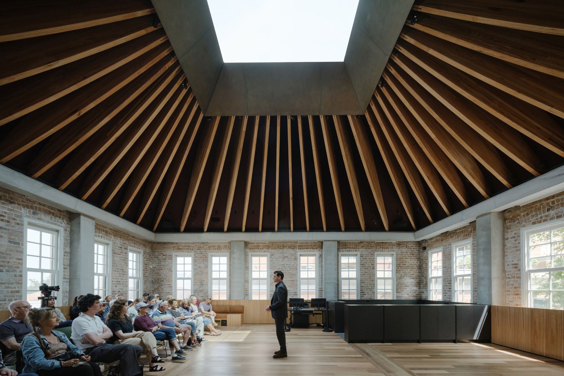Stunning tapered ceiling beams made from MASSLAM and fabricated by TGA Engineers, leading to a vast skylight at the restored Boot Factory building in Bondi Junction. Image Hamish McIntosh