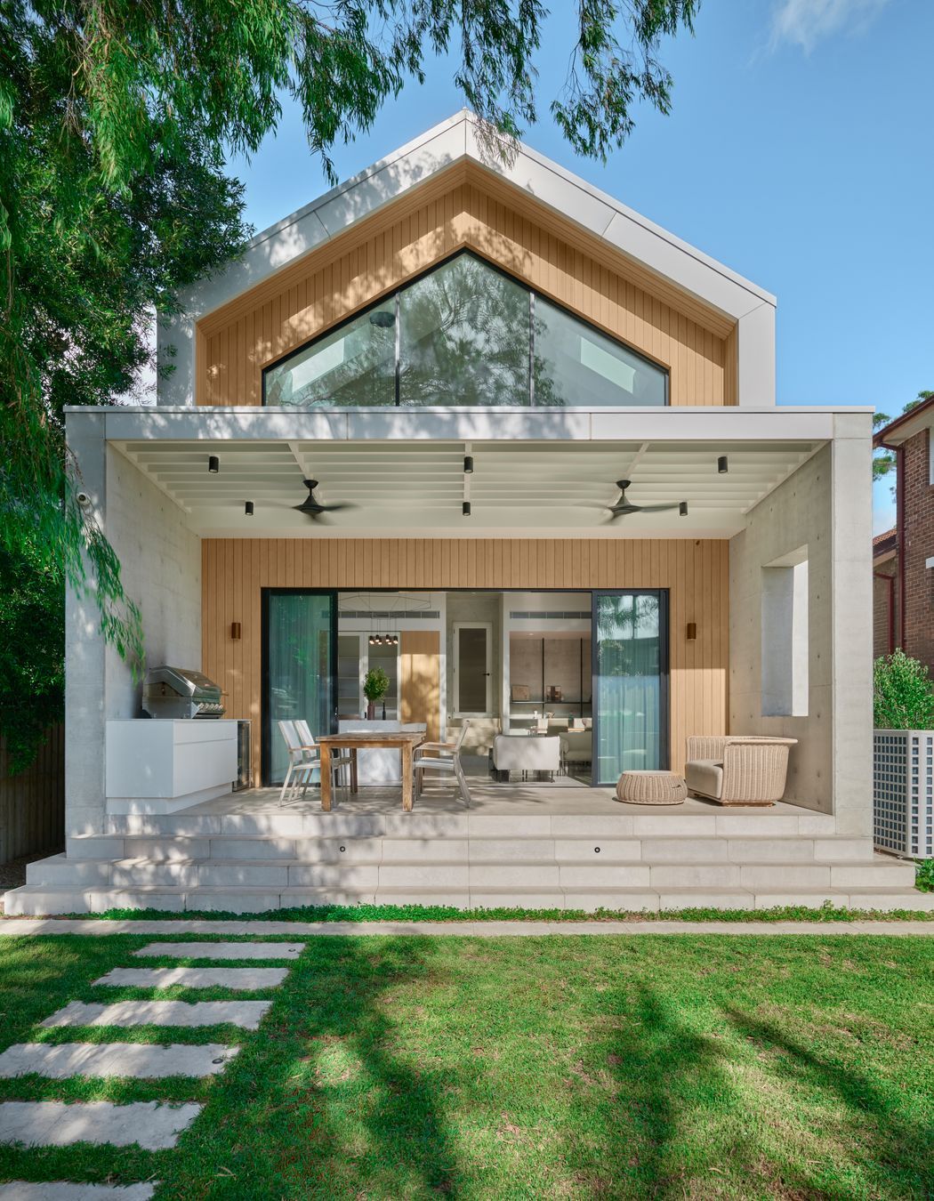 Gable House in Kensington by SSD Studios. Blending Chinese and Irish heritage with European barn-style architecture, Luna Chiaro Limestone flows seamlessly from interior to outdoor entertaining areas. A 2025 project where cultural layers and natural materials unite.