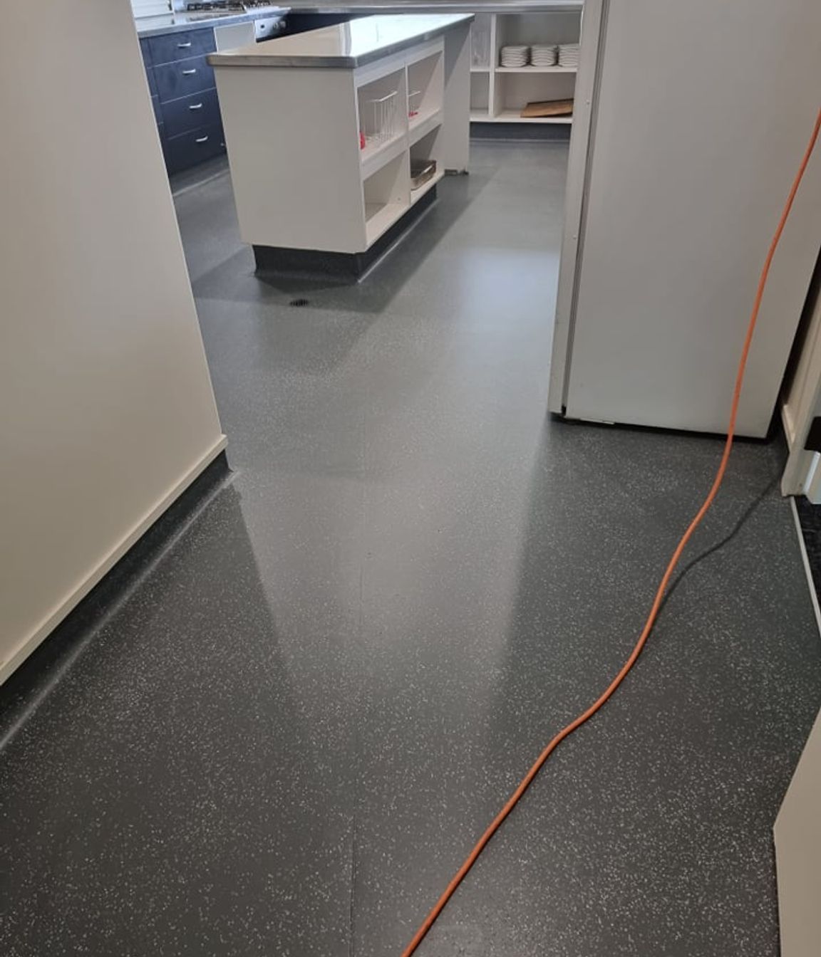 In this commercial kitchen space, a refreshed floor colour with Bona Resilient coating update the space, extending the life of the vinyl for years to come.