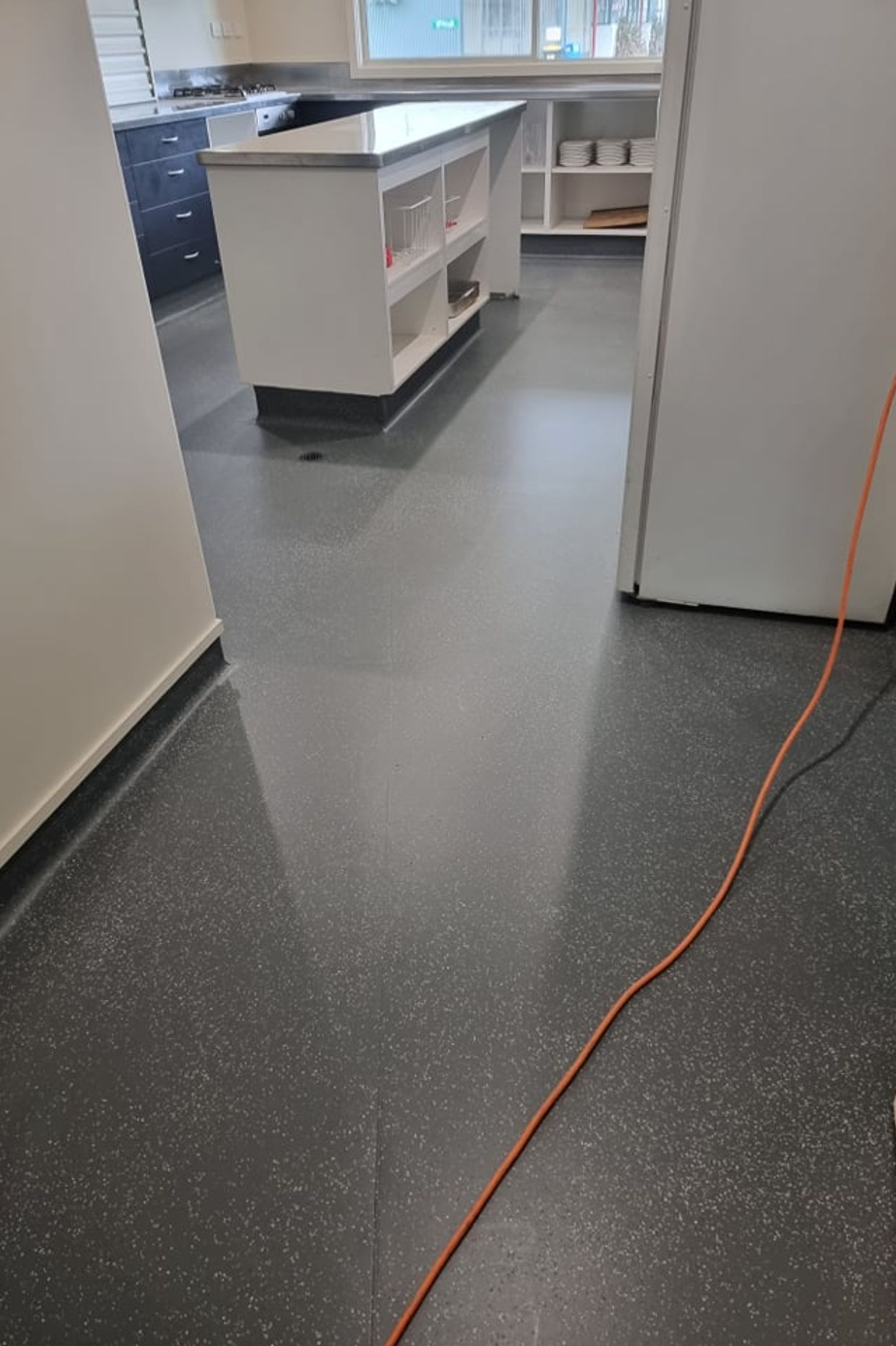 In this commercial kitchen space, a refreshed floor colour with Bona Resilient coating update the space, extending the life of the vinyl for years to come.