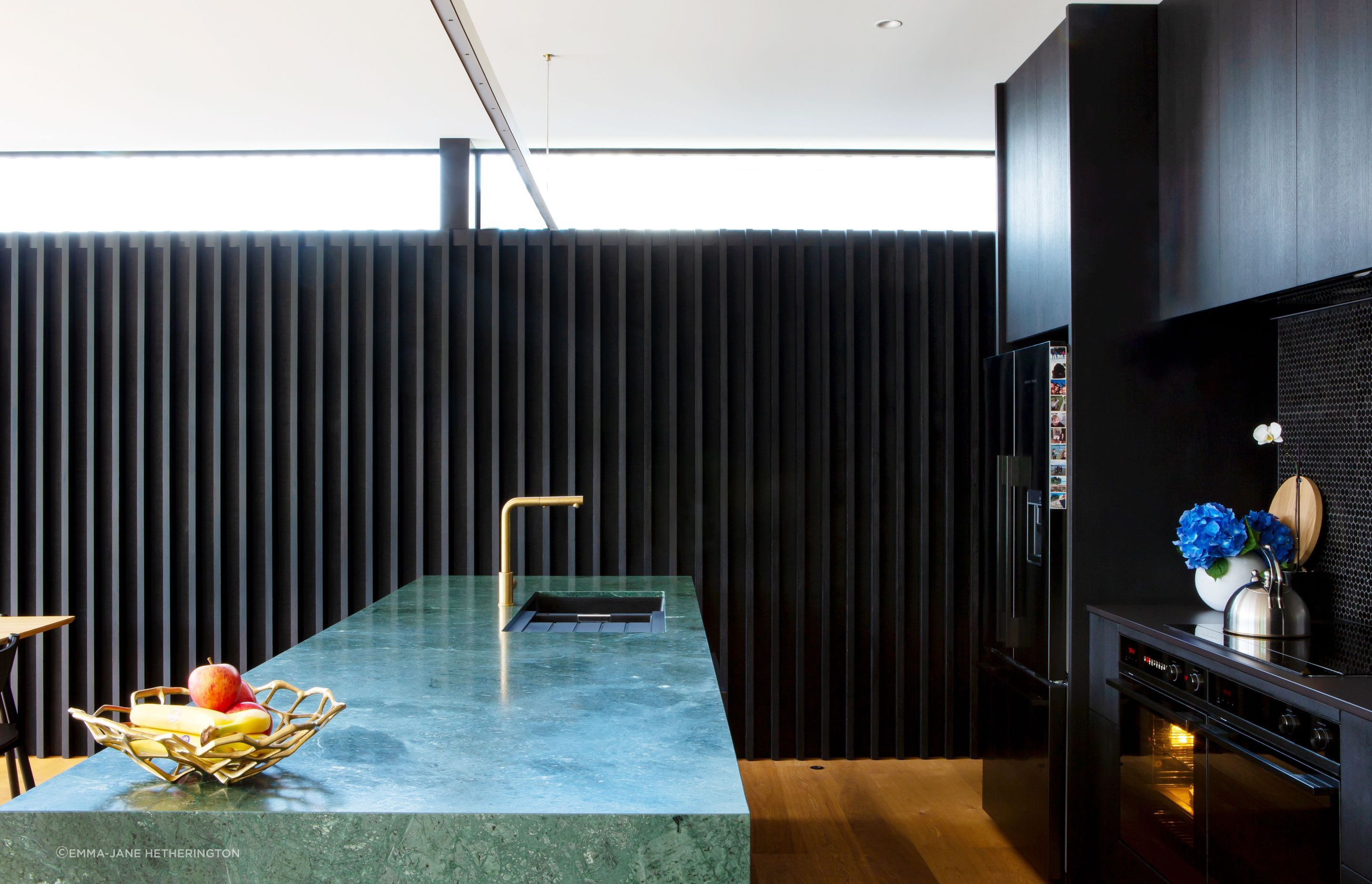 The Buddy mixer is from Plumbline and the appliances are Fisher & Paykel. Dorrington Atcheson Architects project architect Sam Lennon first suggested the green marble island even though previous clients had shied away from such a bold statement.