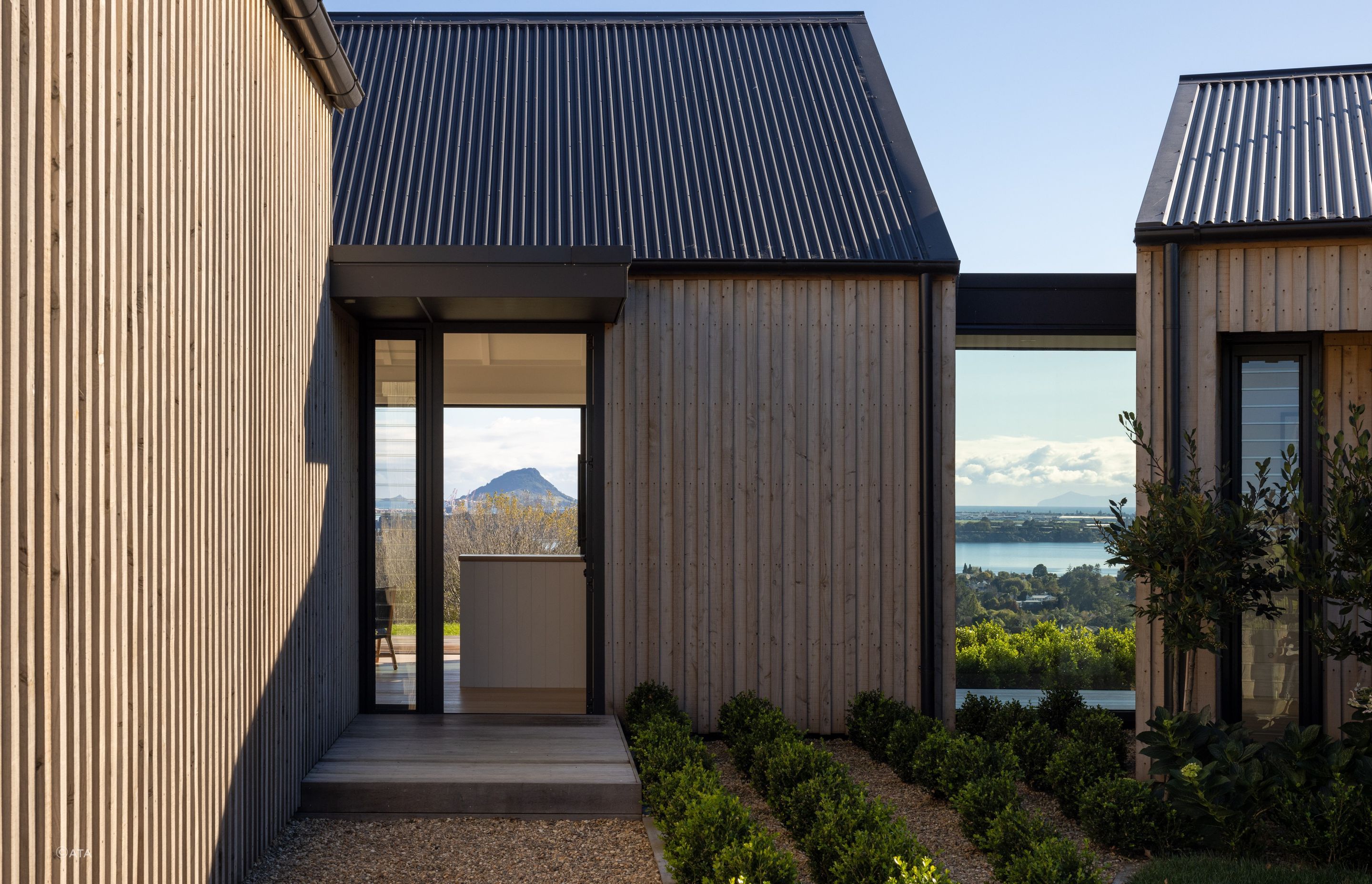 Guests to this home in Welcome Bay are greeted to the spectacular view of Mt Maunganui as soon as the front door opens - Photography: Simon Devitt