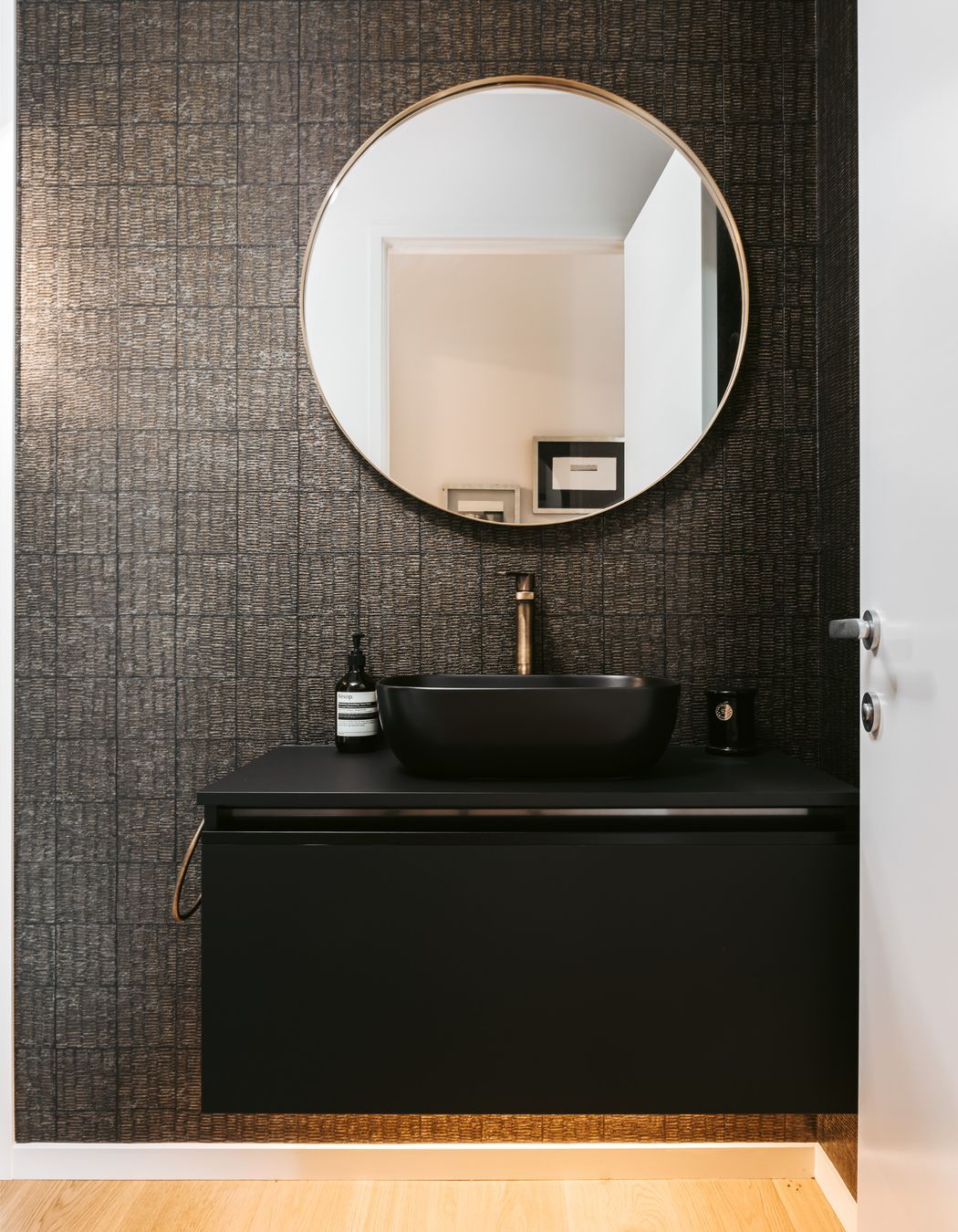 A considered approach to form and function, the bathroom lights turn on automatically.