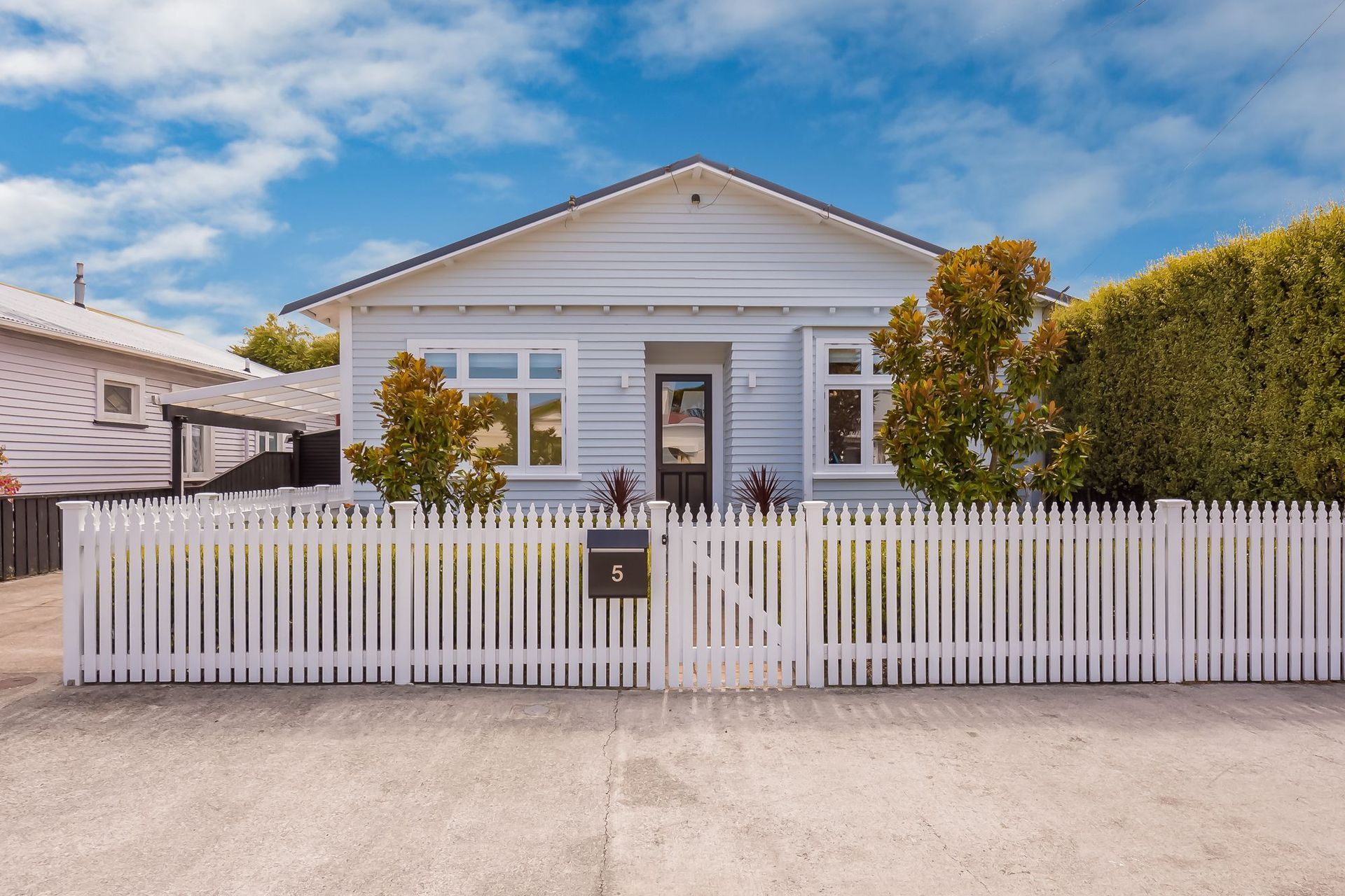 There's no shortage of great ideas for how to design your front door like this numbered approach for this cottage in Petone - Photography: Wendy Powell