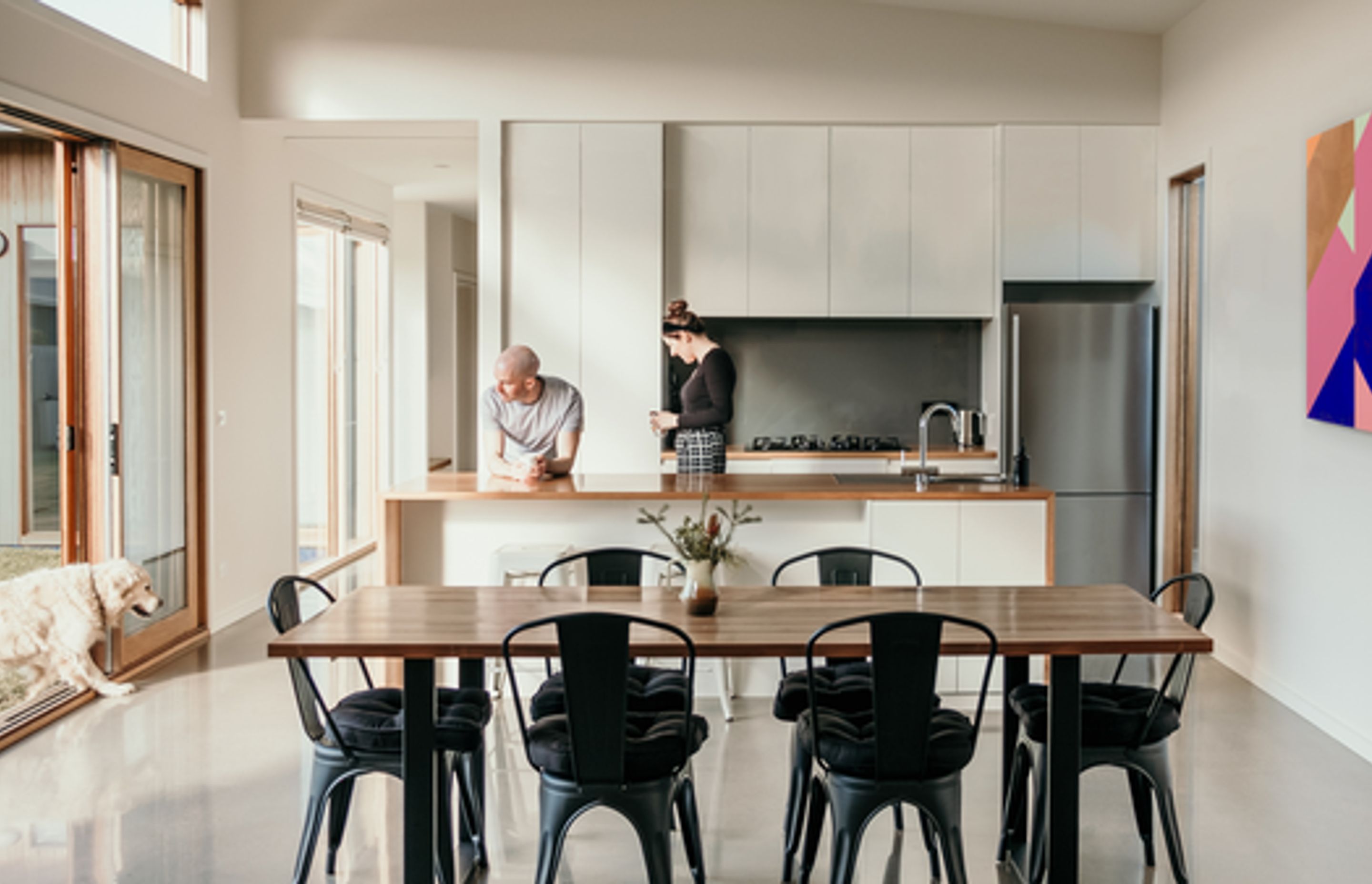 Image: High ceilings and light filled living areas in the L Shape House.