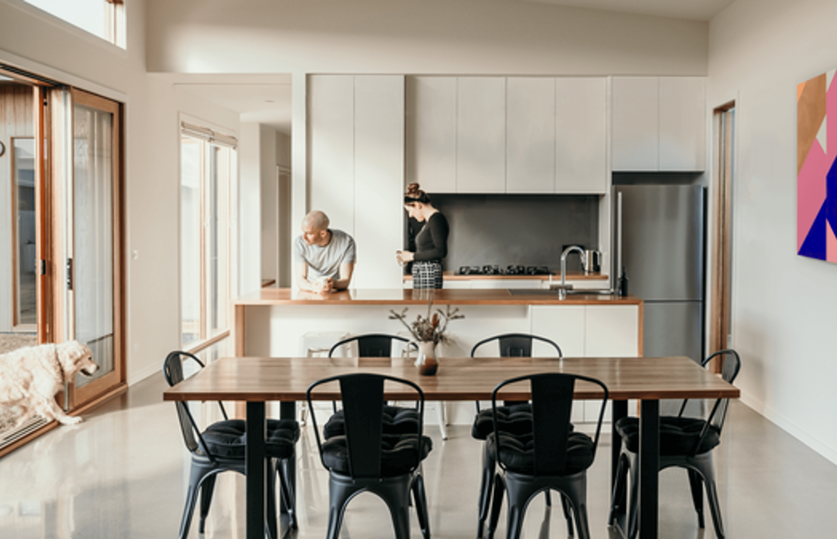 Image: High ceilings and light filled living areas in the L Shape House.