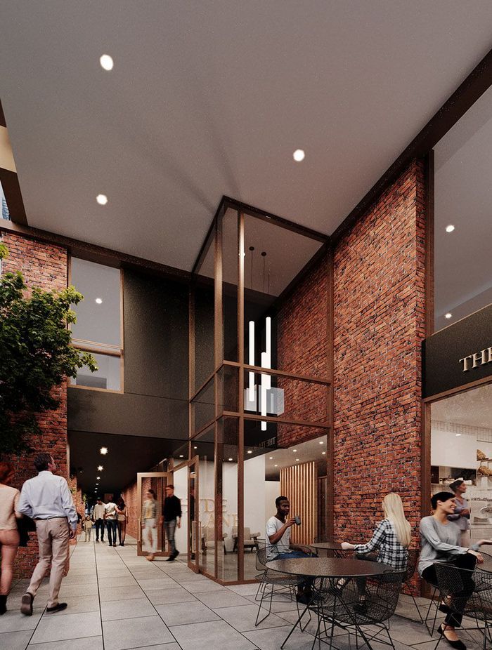 The double-height fully-glazed entrance to Hyde Lane’s apartment building.
