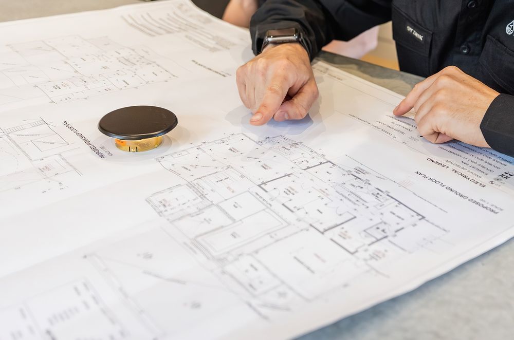 Our Founder and sprinkler fitter, Raphael Corbett assessing house plans.