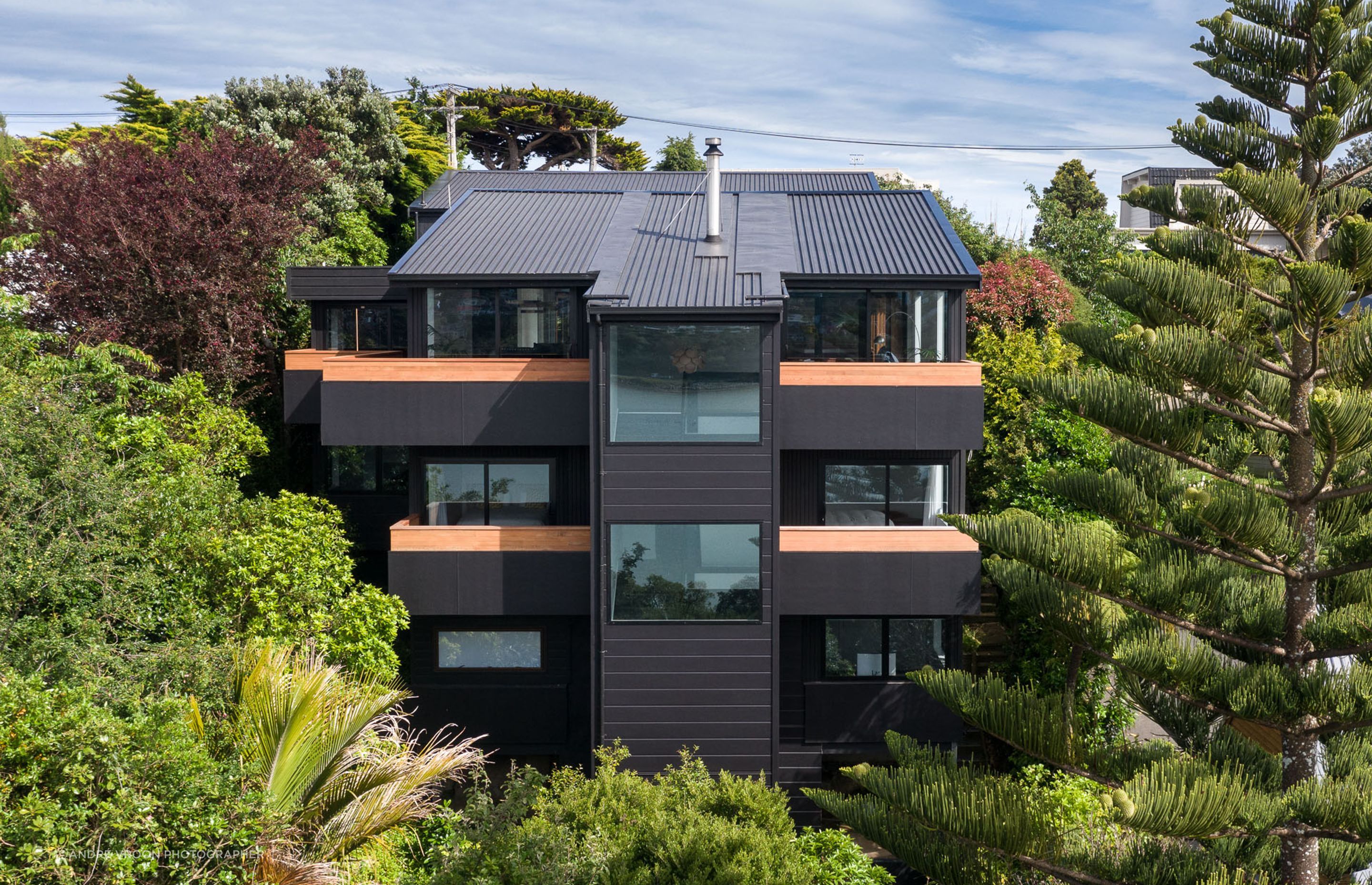 The house’s protective facade, designed to enhance views from the interior out across the harbour.