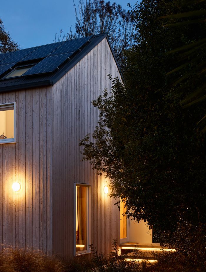 The home maintains an inviting aura even as night falls.