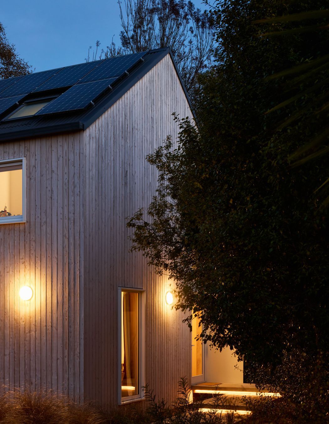 The home maintains an inviting aura even as night falls.