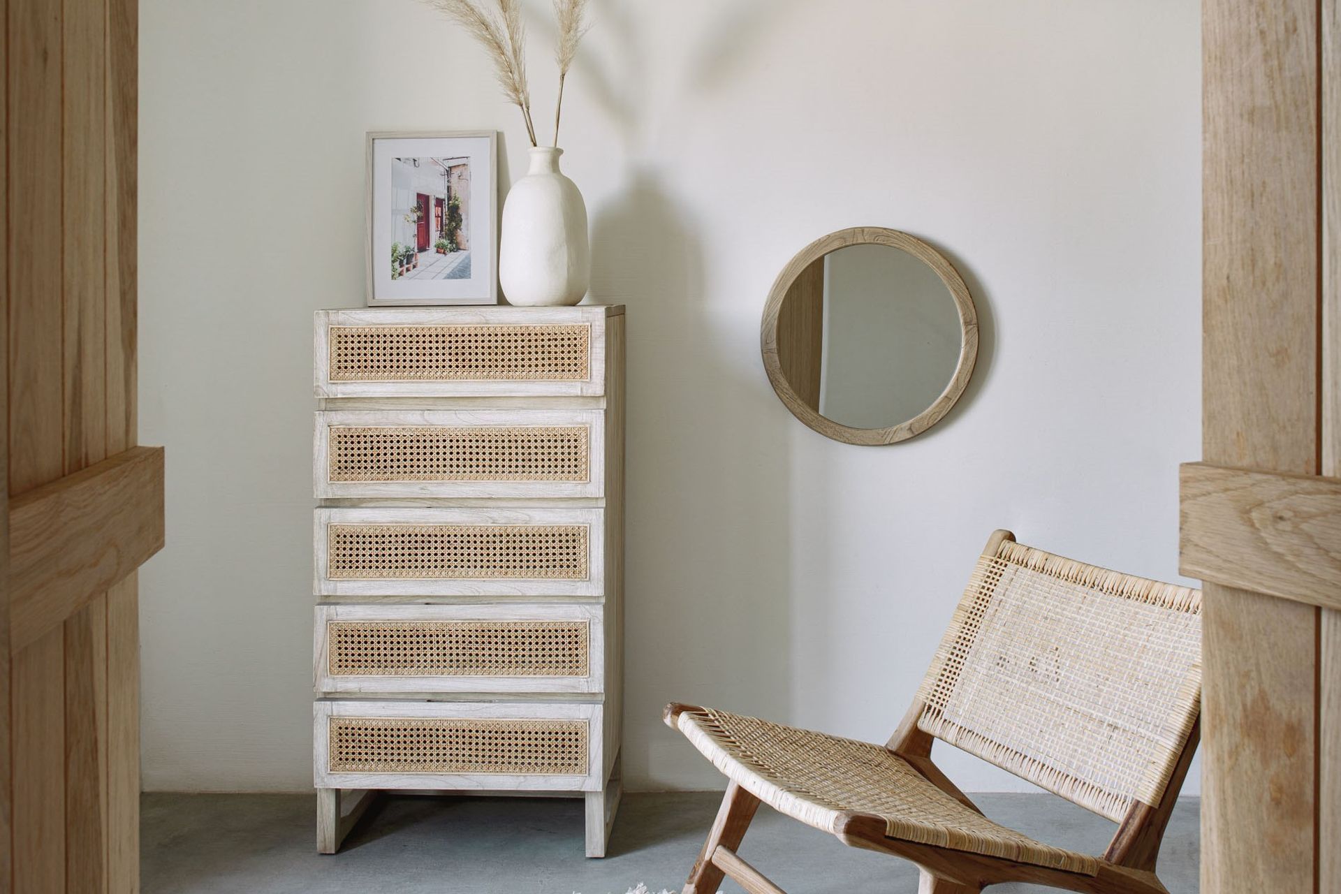 Wooden frames and rustic charm personify the Alum Round Solid Mindi Wood Mirror