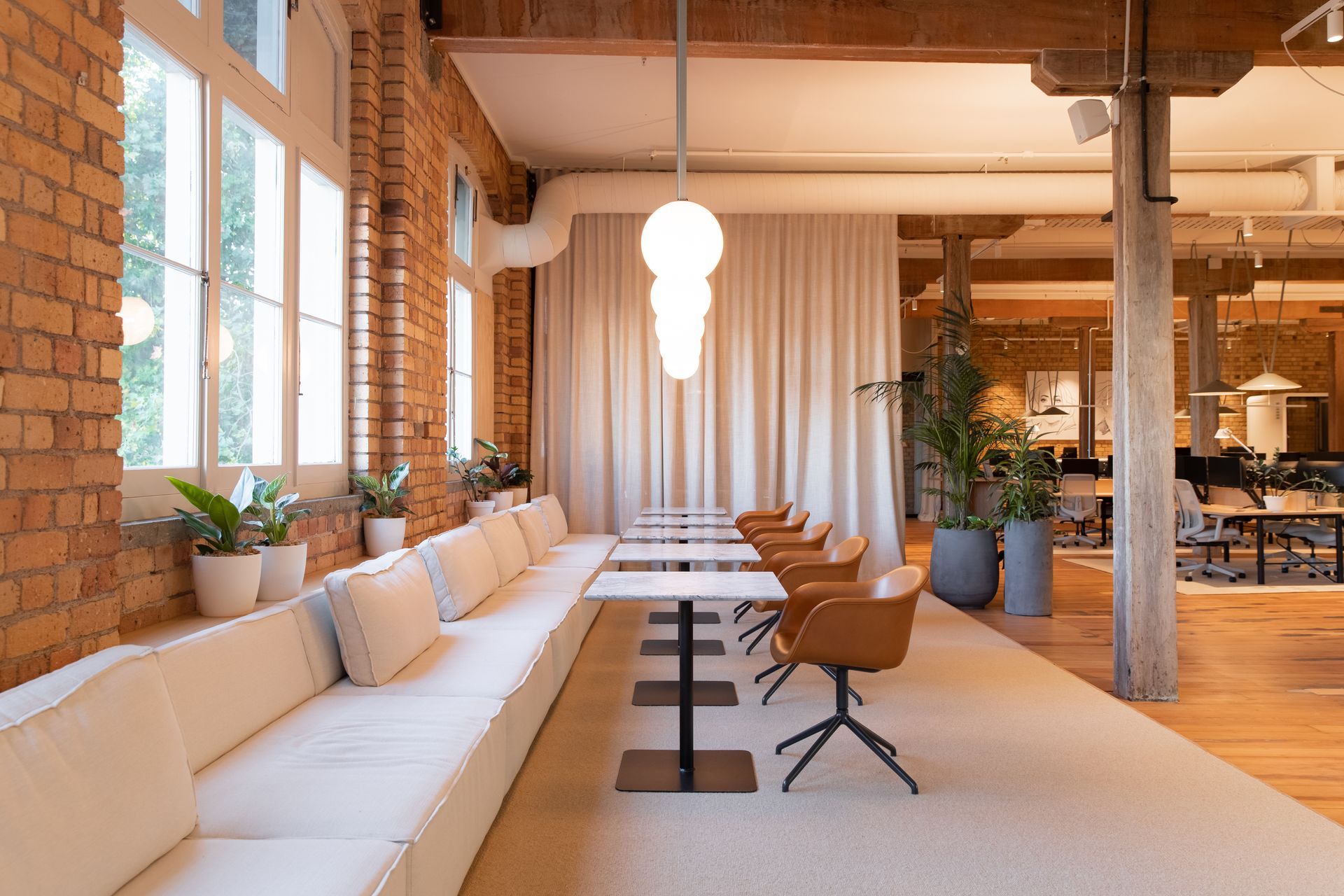 The lounge, situated alongside the heritage building's beautiful casement windows. | Photographers: Oliver Compton & Millie Cossou