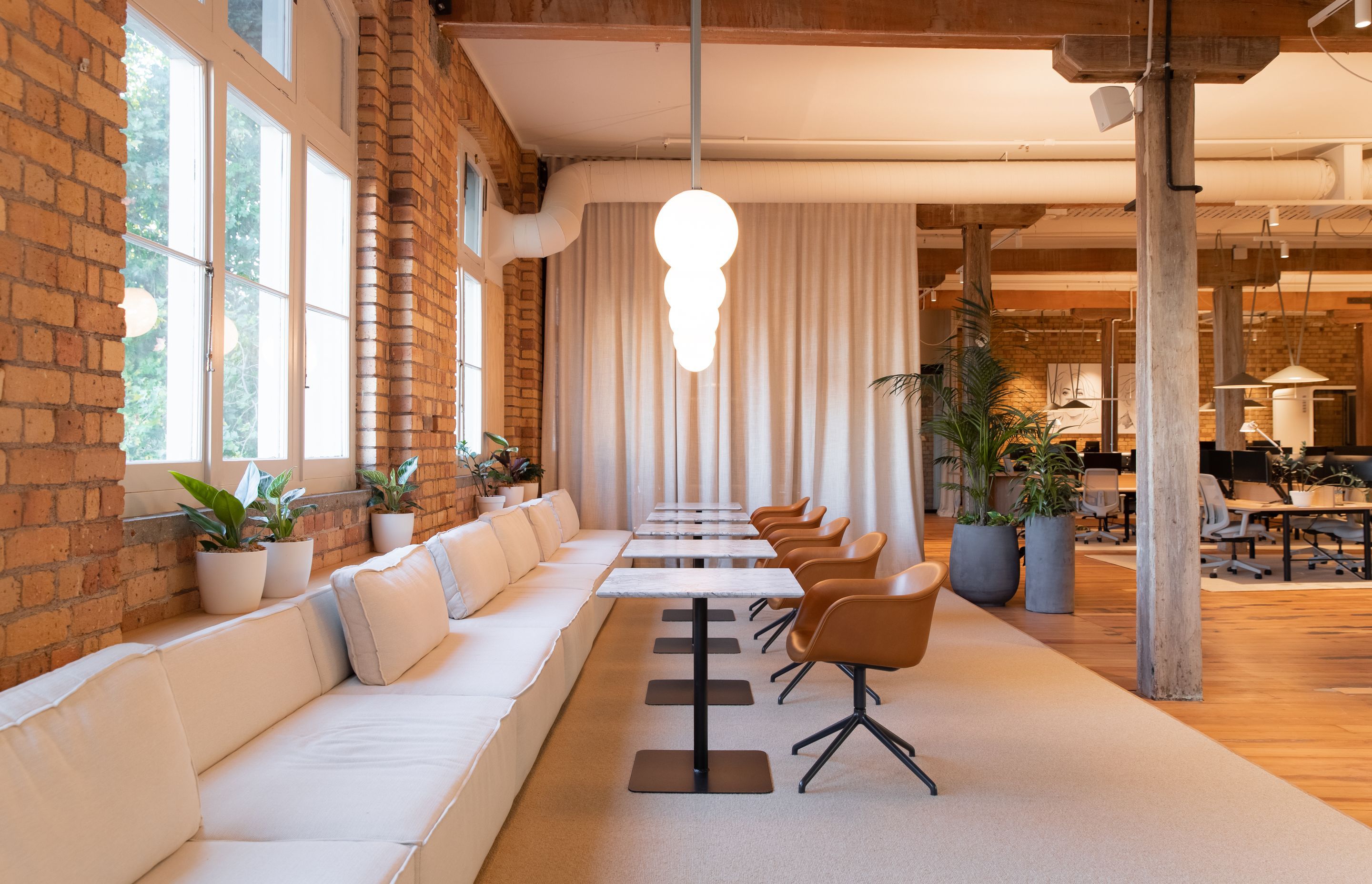 The lounge, situated alongside the heritage building's beautiful casement windows. | Photographers: Oliver Compton & Millie Cossou