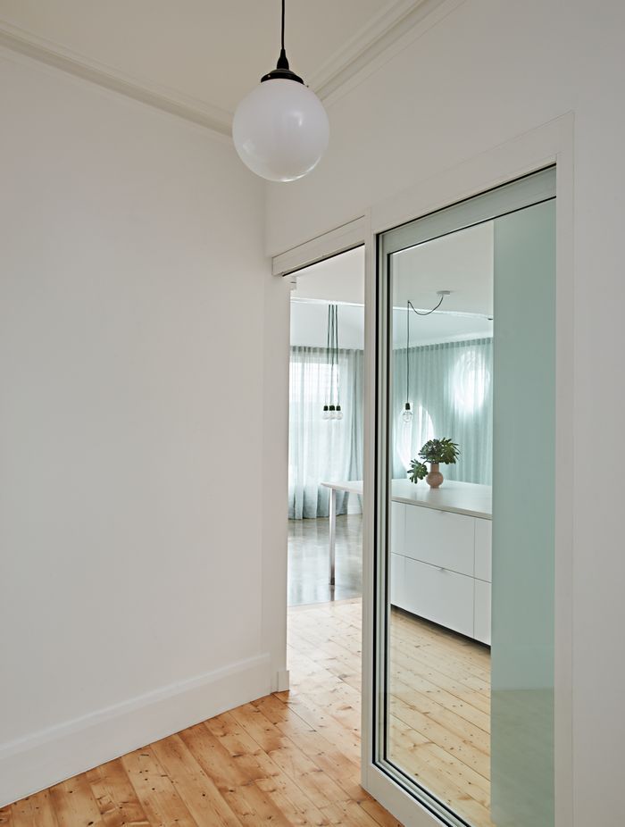 An airy extension to this 1980s California Bungalow-style home allows it to accomodate the client as well as his daughter and granddaughter | GreenHouse Northcote by Ansari Architects | Photography by Michelle Williams