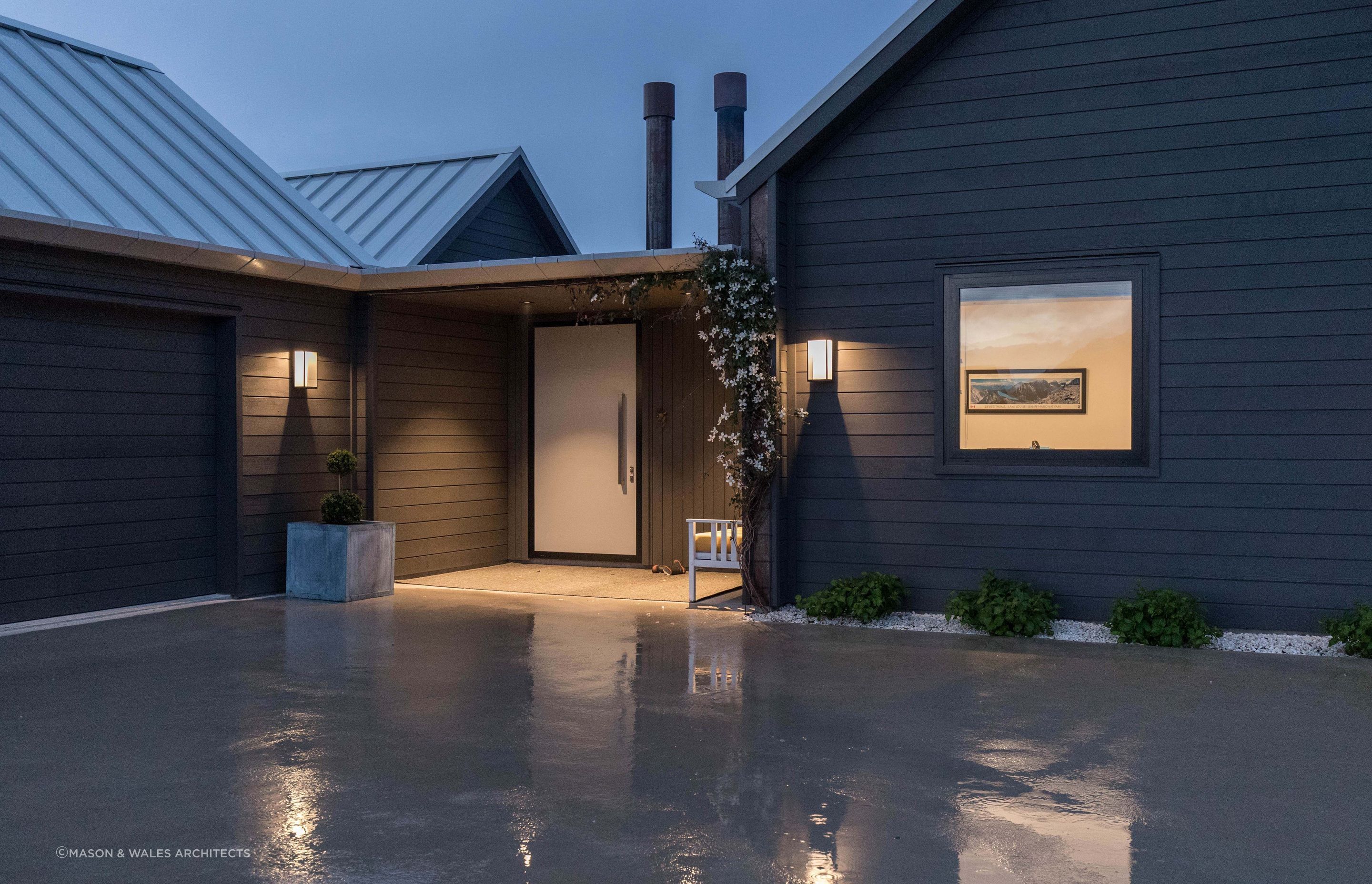 Flowering vines are the perfect complement to the entrance of this Wakatipu Basin home