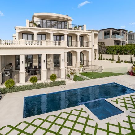 A grand Italianate home built with a glass floor