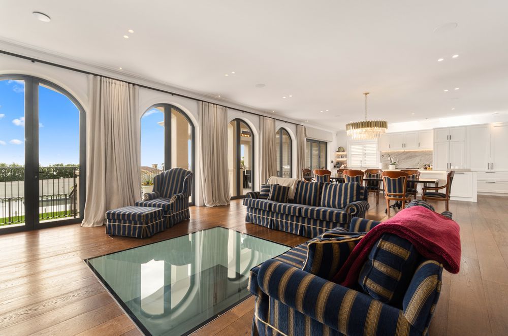 A grand Italianate home built with a glass floor