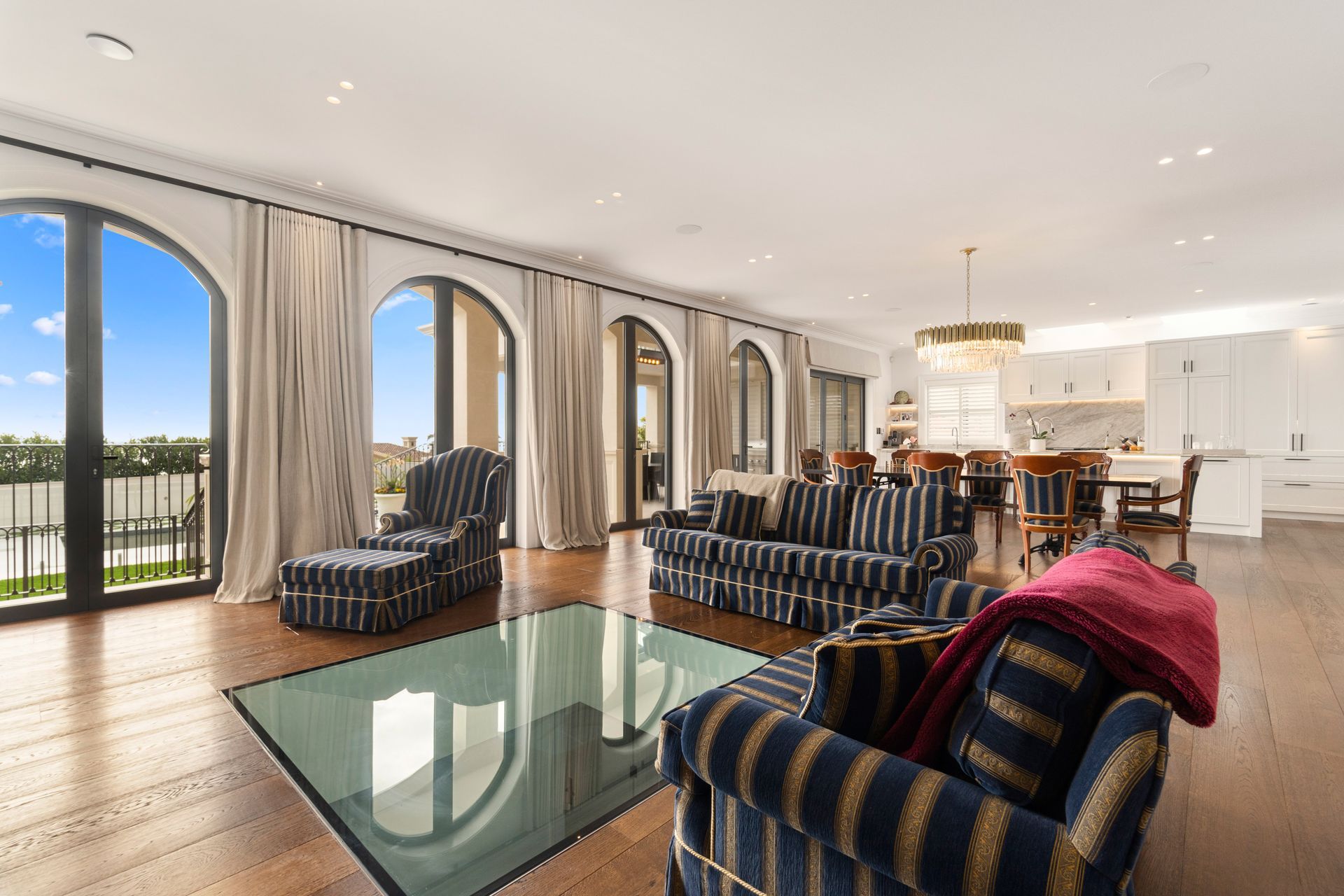 A grand Italianate home built with a glass floor