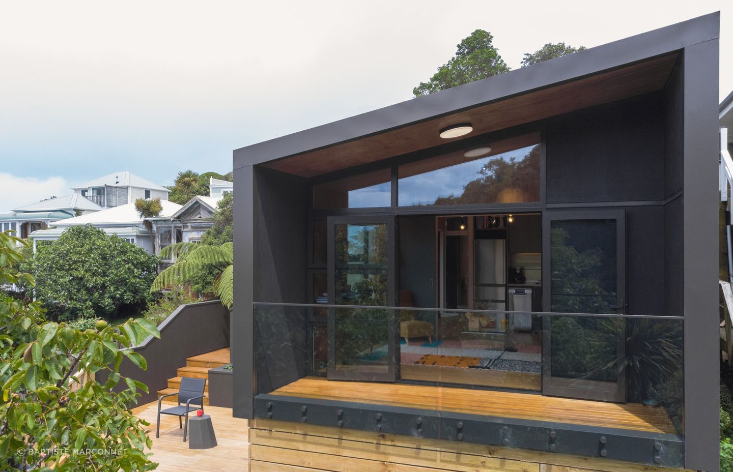 This porch module functions as an extension to the multi-use module, providing covered outdoor living space.