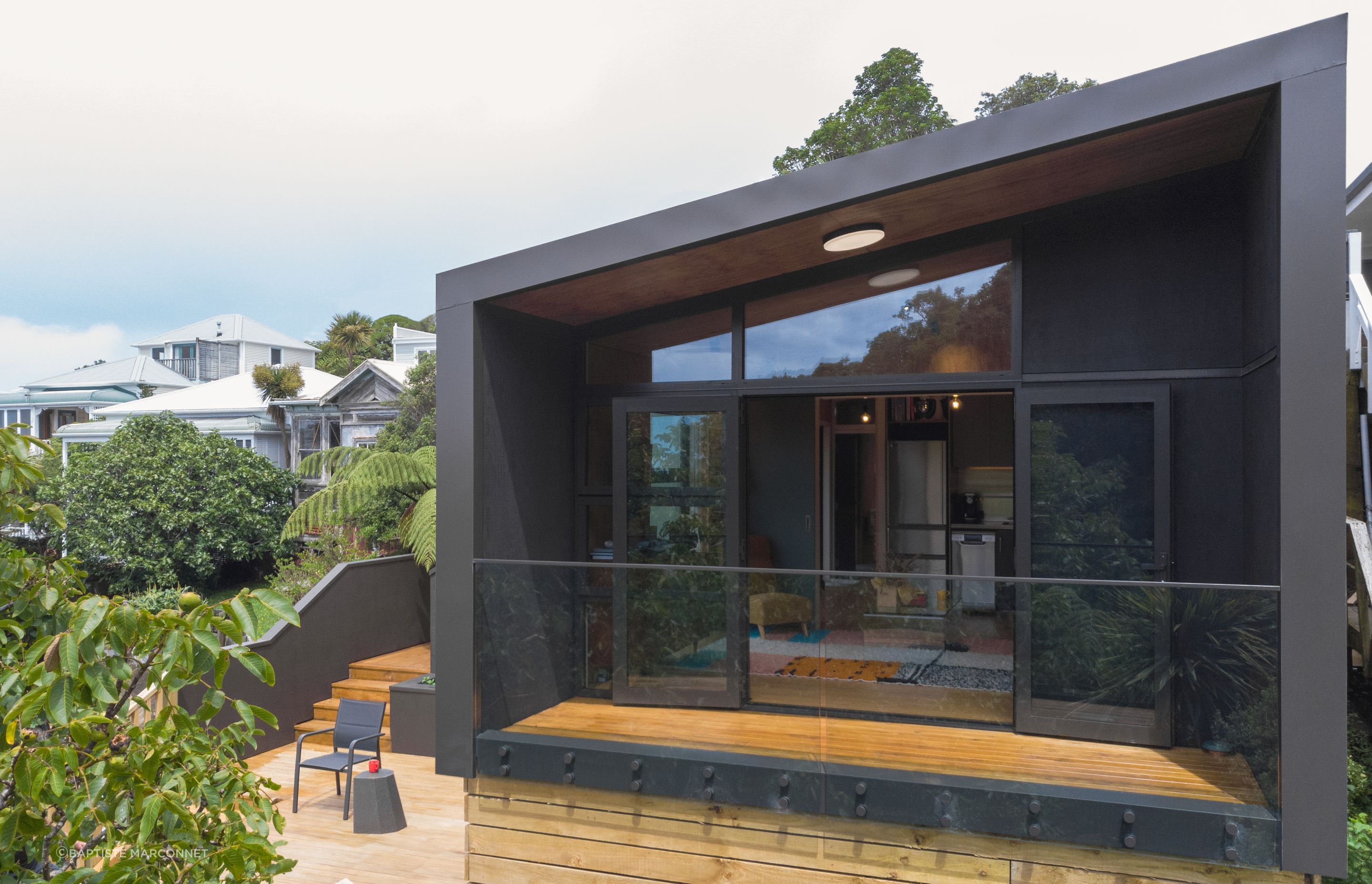 This porch module functions as an extension to the multi-use module, providing covered outdoor living space.