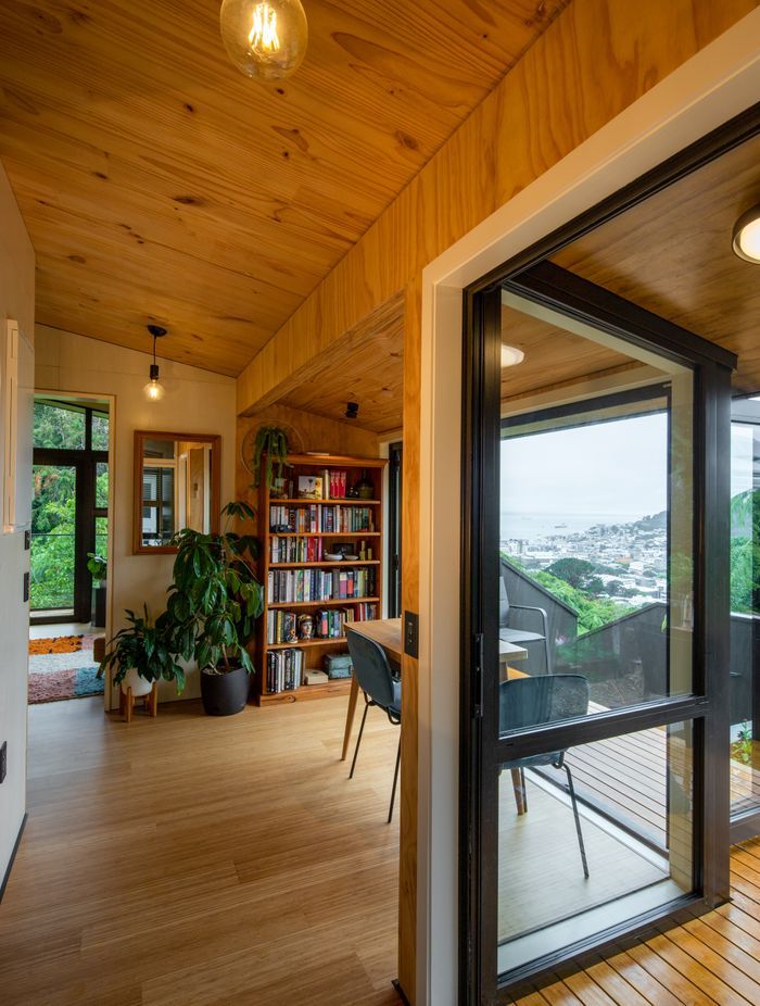 Here, the sunspace module functions as a dining space, connected to the side of the services module.