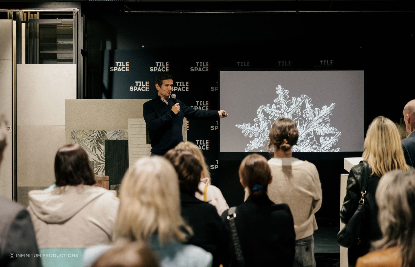 Tom engages with the crowd at Tile Space