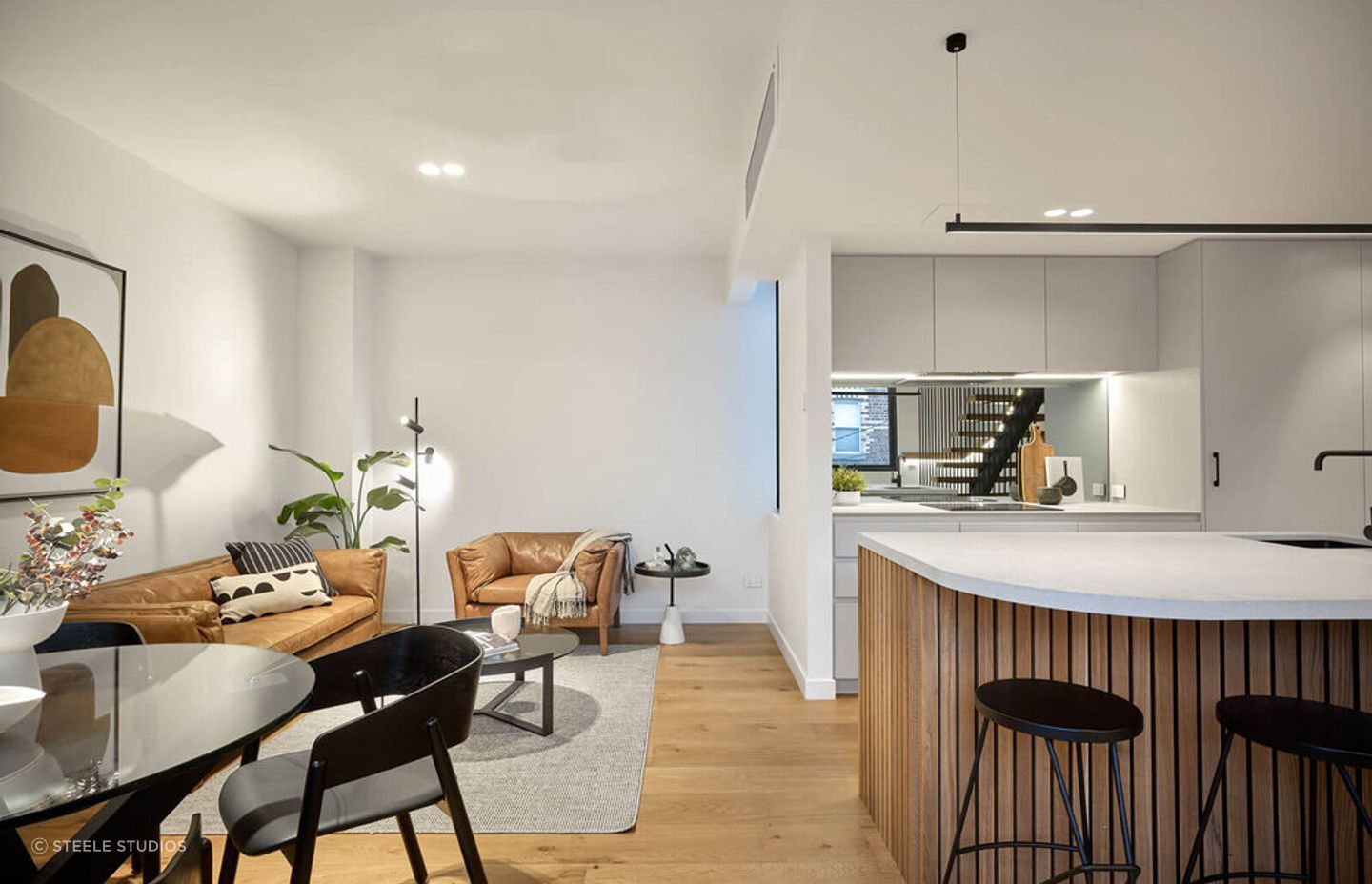 The kitchen and living spaces seamlessly blend together.