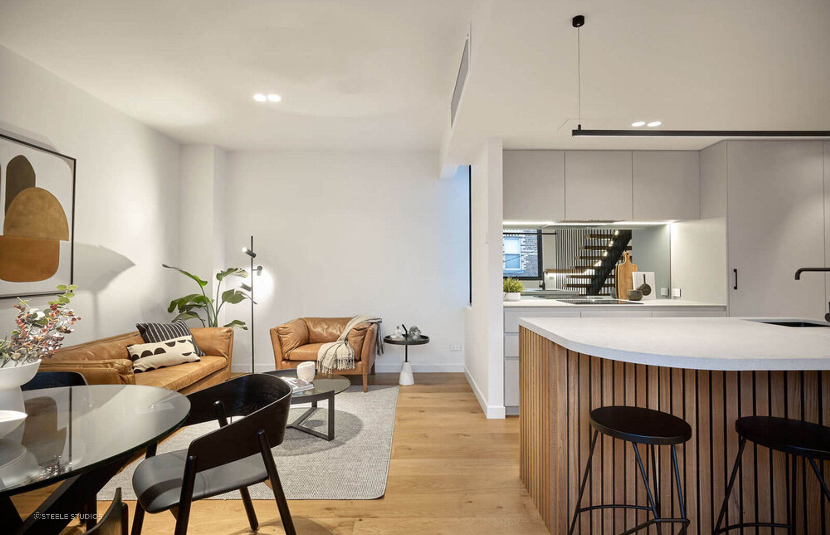The kitchen and living spaces seamlessly blend together.
