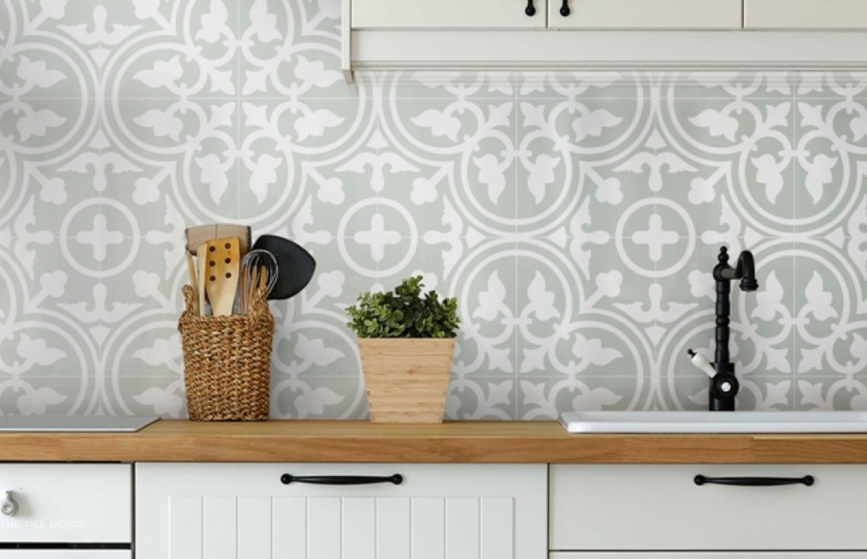 Artisan patterned tiles from Tile depot were used as a splashback. The neutral and light colours used are versatile and can be used for most kitchen designs. The patterns on the tile give the kitchen an artistic look and elevates the overall design of the