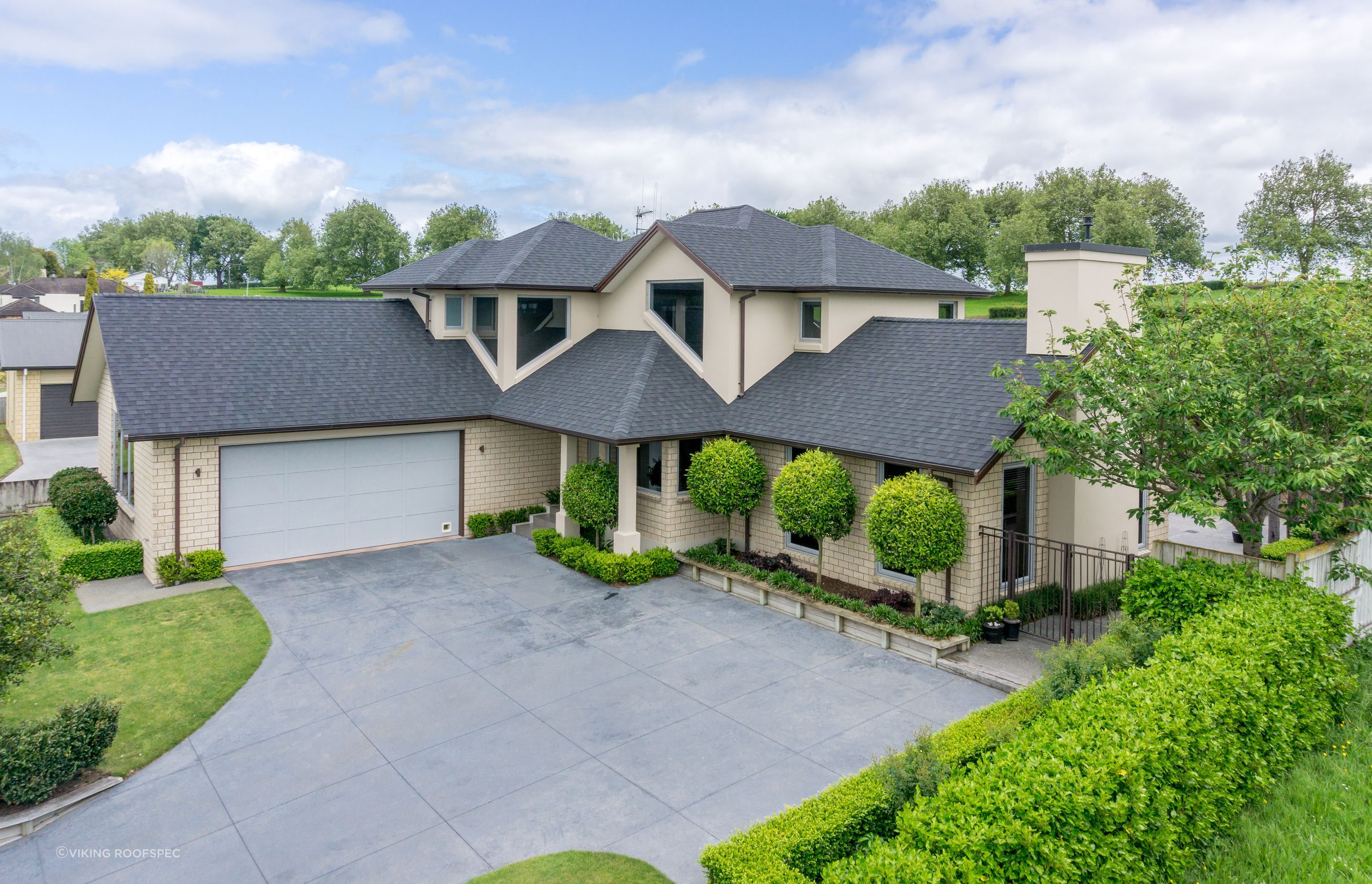 These Viking Certainteed Asphalt shingles impart a stylish and classical look to this home's roof.