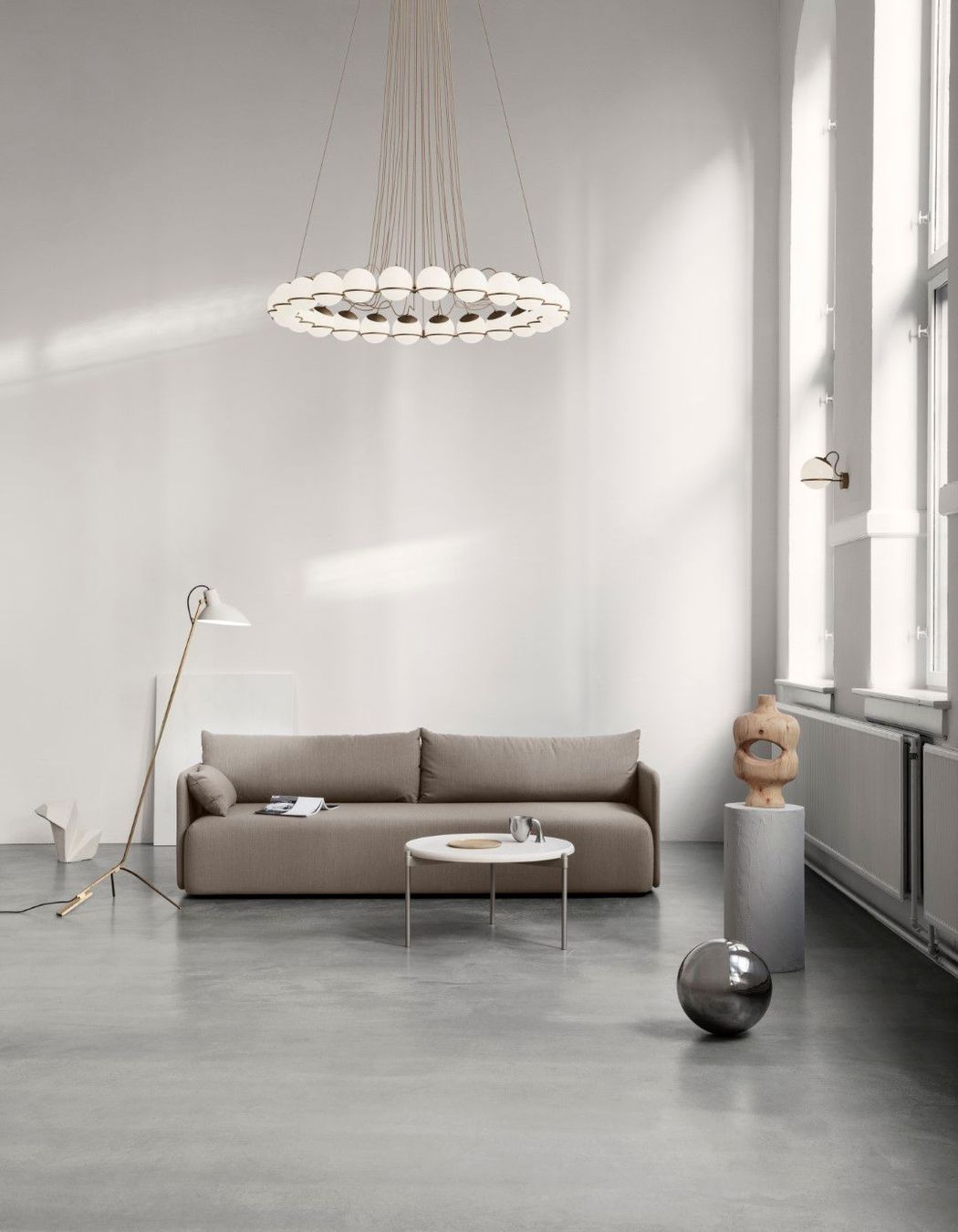 Astep defines the height and details in a room with a family of lighting objects from Gino Sarfatti, the 'Le Sfere' collection.
