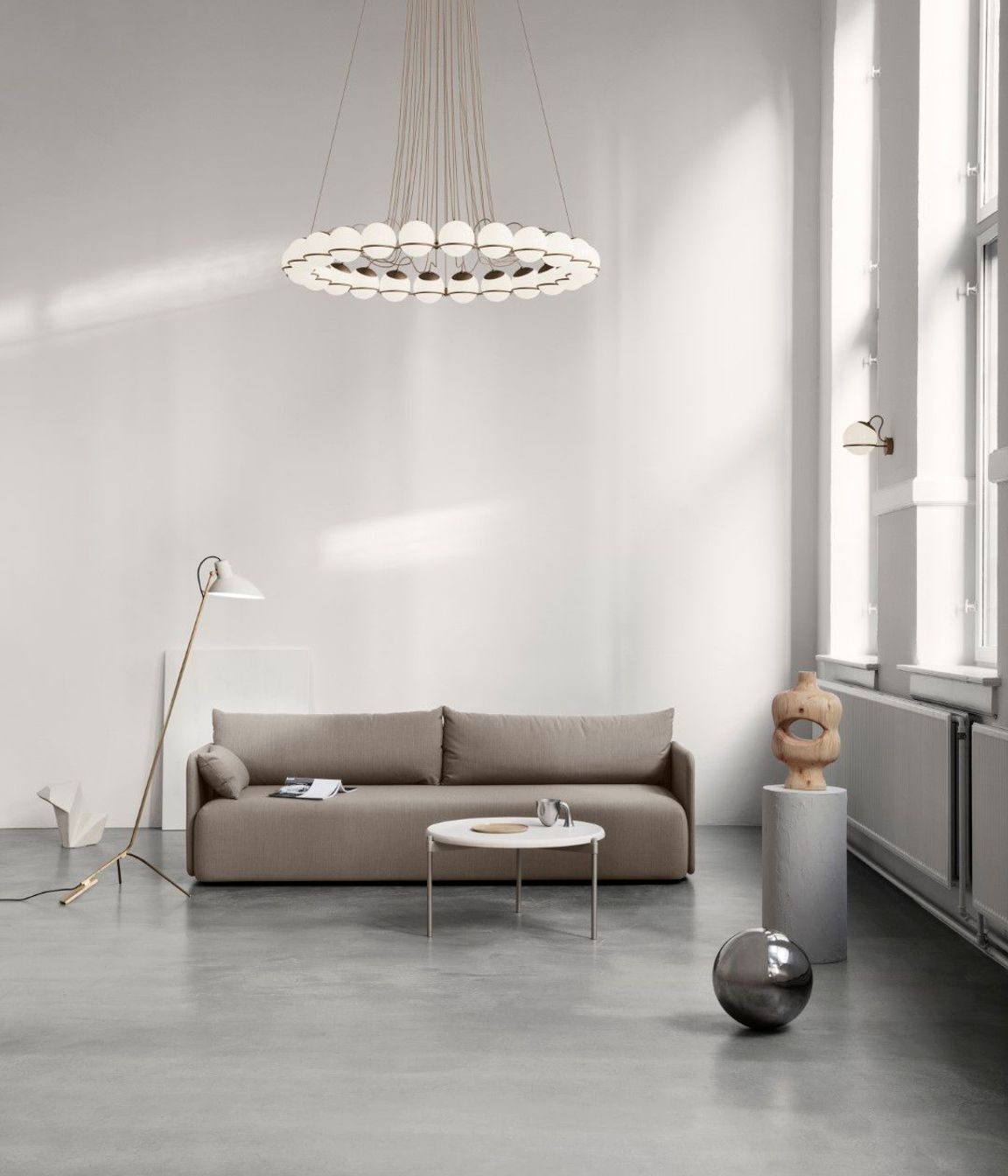 Astep defines the height and details in a room with a family of lighting objects from Gino Sarfatti, the 'Le Sfere' collection.