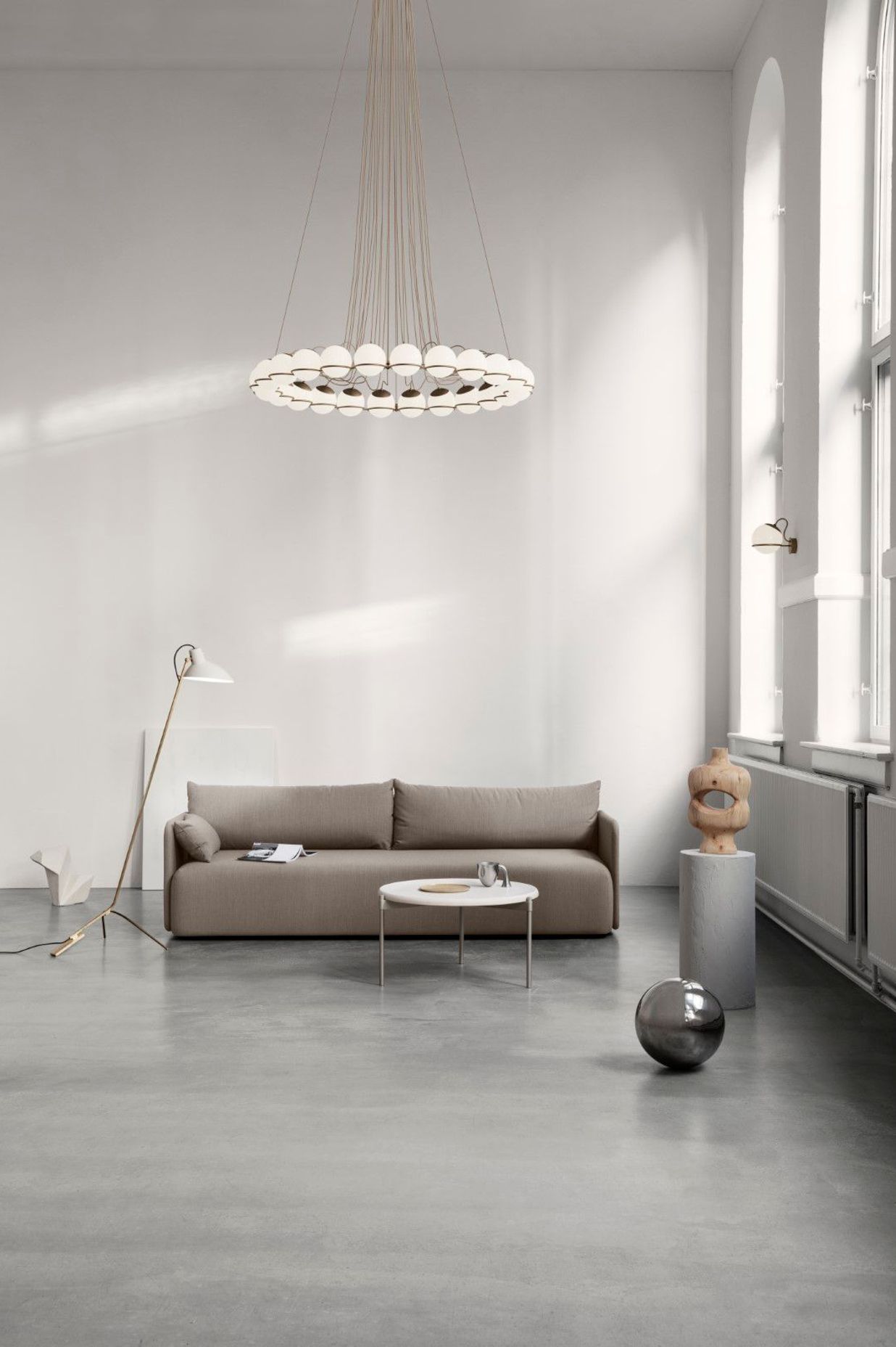 Astep defines the height and details in a room with a family of lighting objects from Gino Sarfatti, the 'Le Sfere' collection.