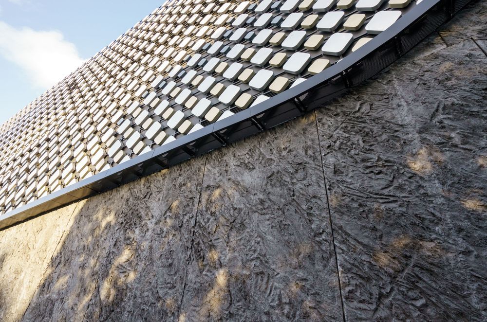 A seven-meter mould with a repeating pattern was created to form the MONARC concrete panels that were tinted with PeterFell SuperBlack to create the desired black granite look.