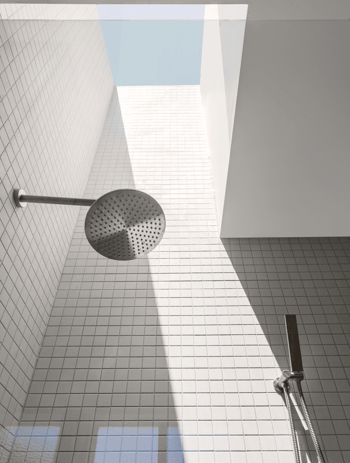 Rain shower heads disperse water evenly to simulate the feeling of rainfall for a soothing experience. Featured project: Brighton East Residence