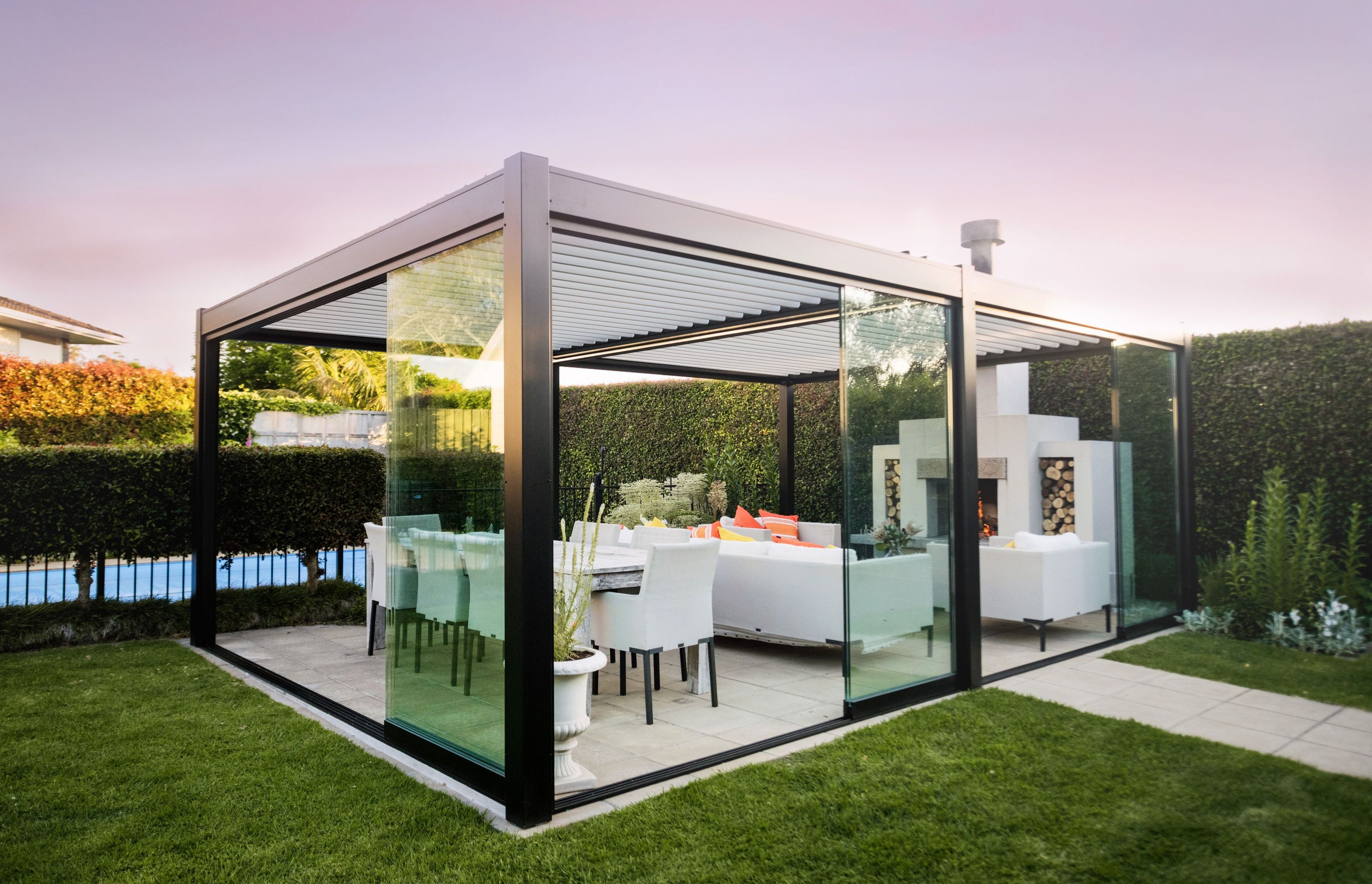 Juralco can design and manufacture your custom outdoor area with glass sliding doors and a louvred roof.