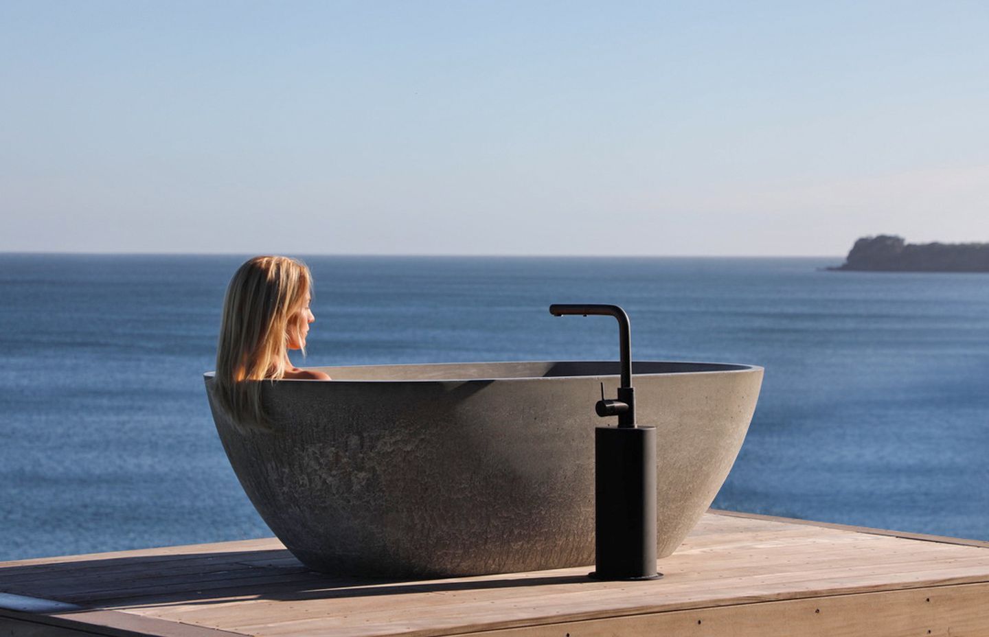 Bridget enjoying the outdoor bath overlooking the view.