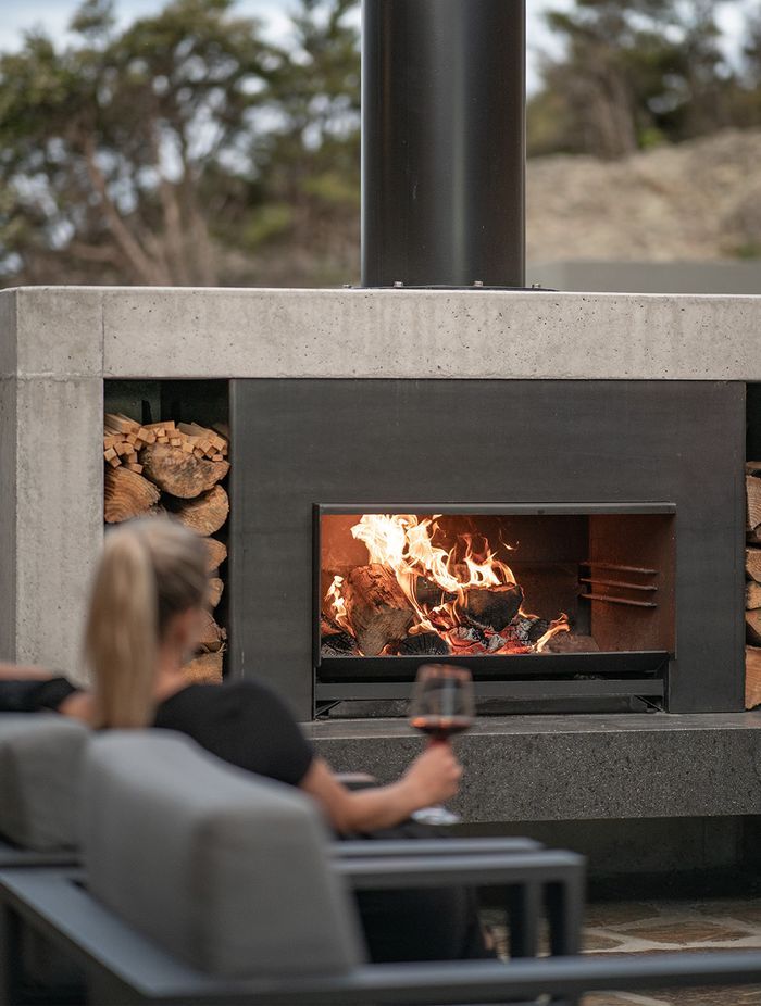 The Escea EW5000 offers three heights to cook on, and when not in use, easily slides under the ash pan.