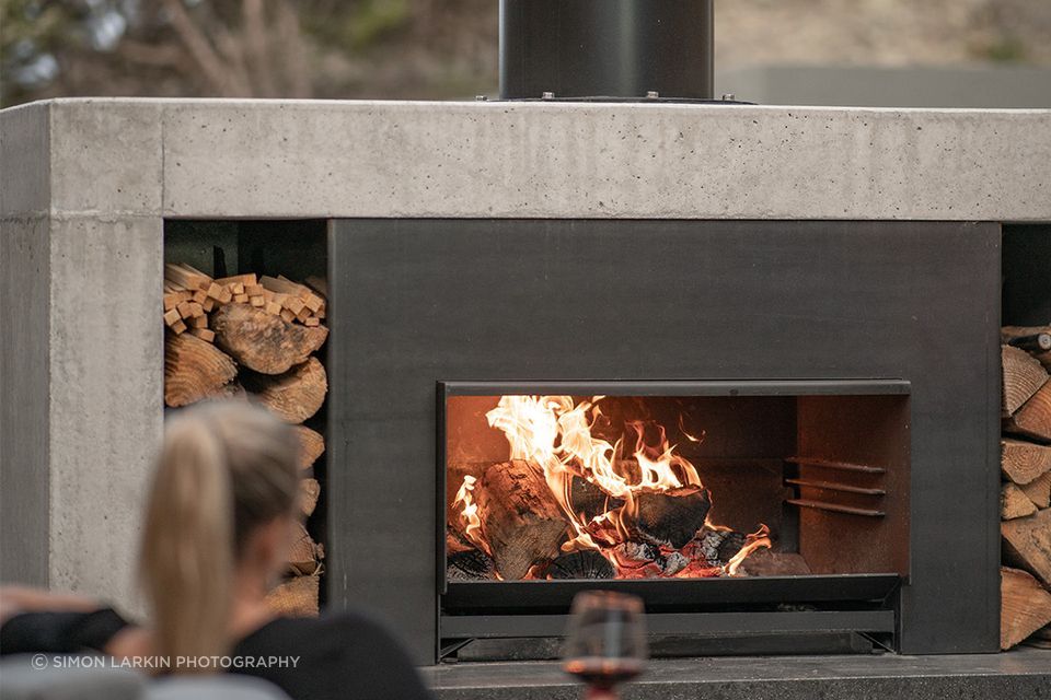 The Escea EW5000 offers three heights to cook on, and when not in use, easily slides under the ash pan.