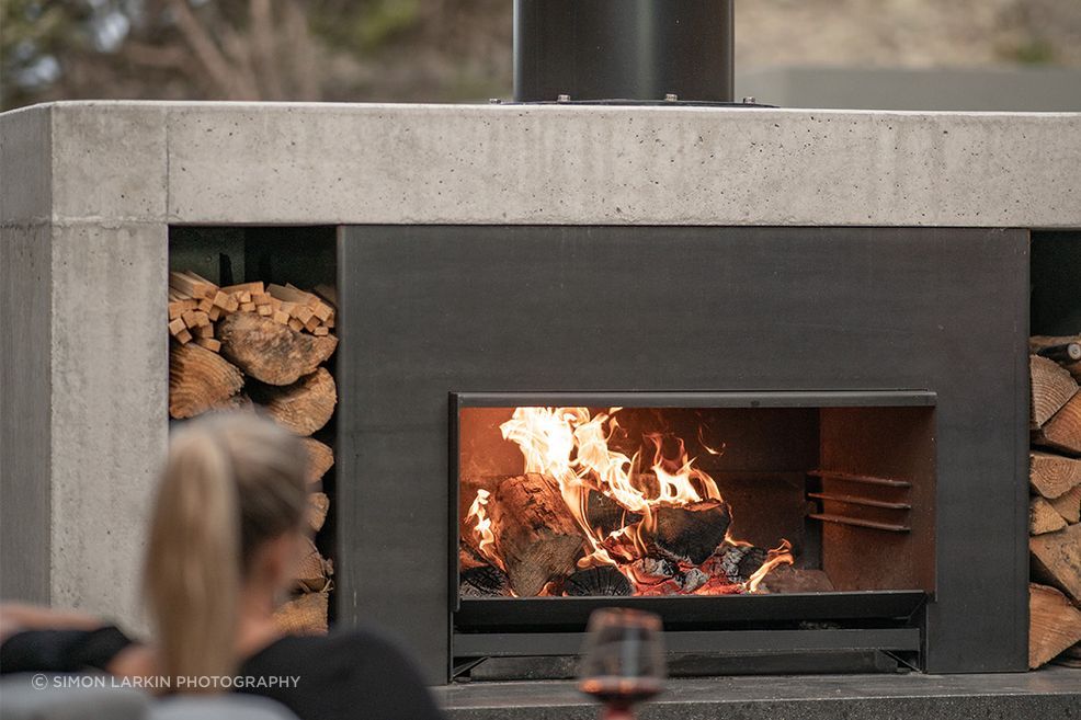 The Escea EW5000 offers three heights to cook on, and when not in use, easily slides under the ash pan.