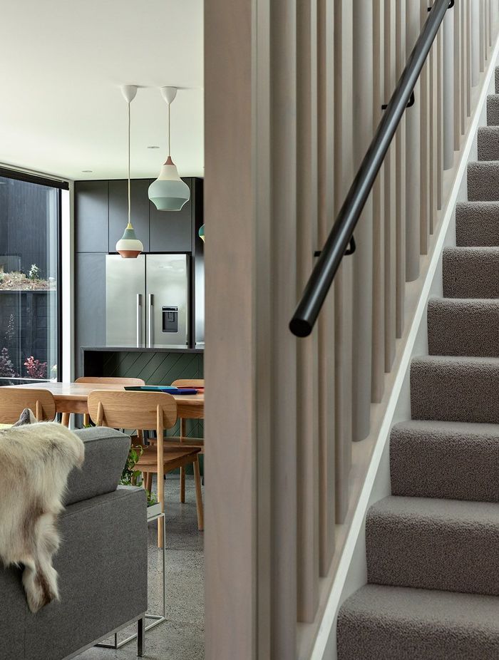 Lighly-stained vertical timber balastrades help to draw light into the living space.