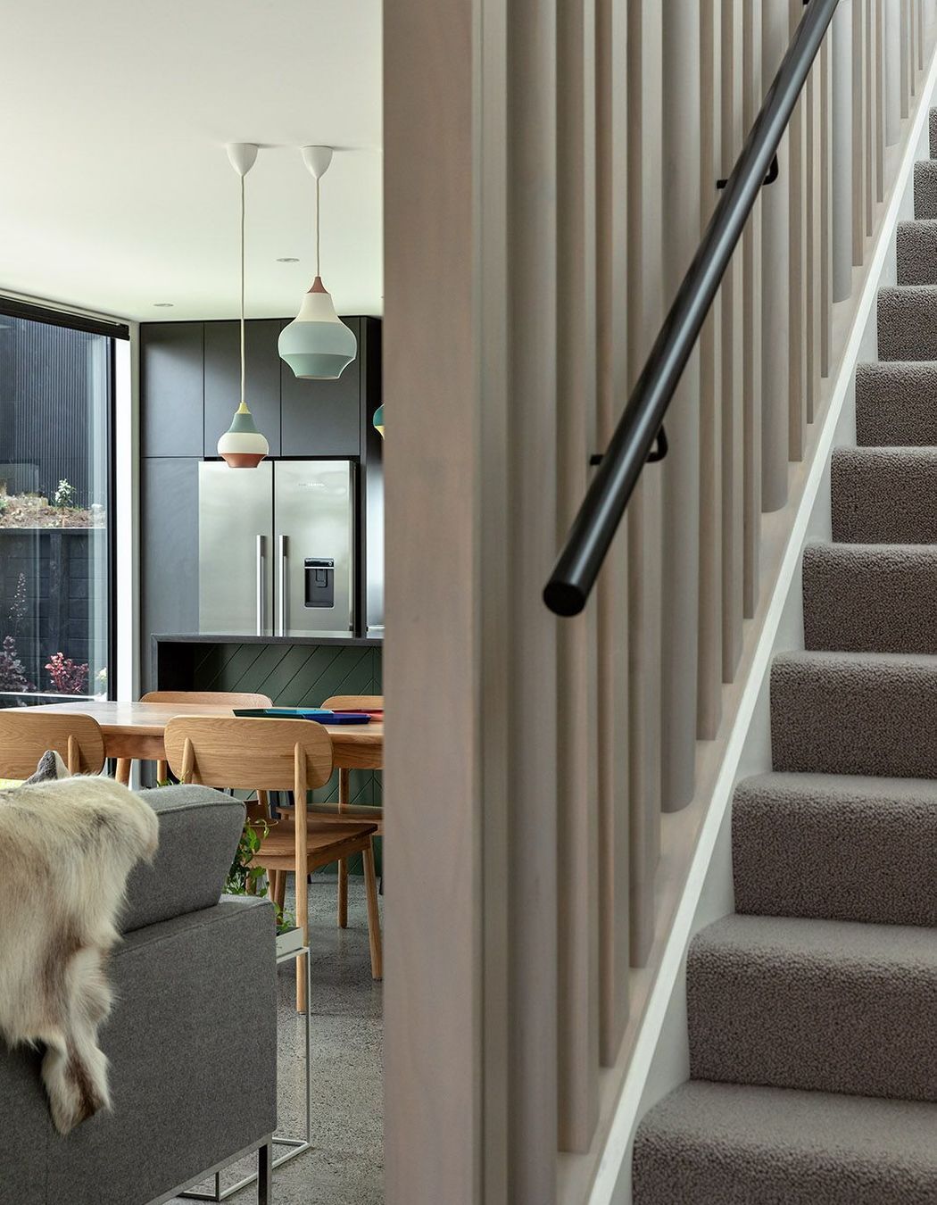 Lighly-stained vertical timber balastrades help to draw light into the living space.